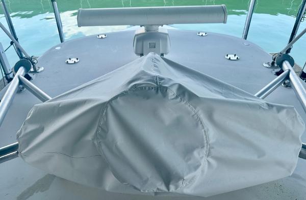 2008 SeaVee 390B boat deck with covered equipment and railing.