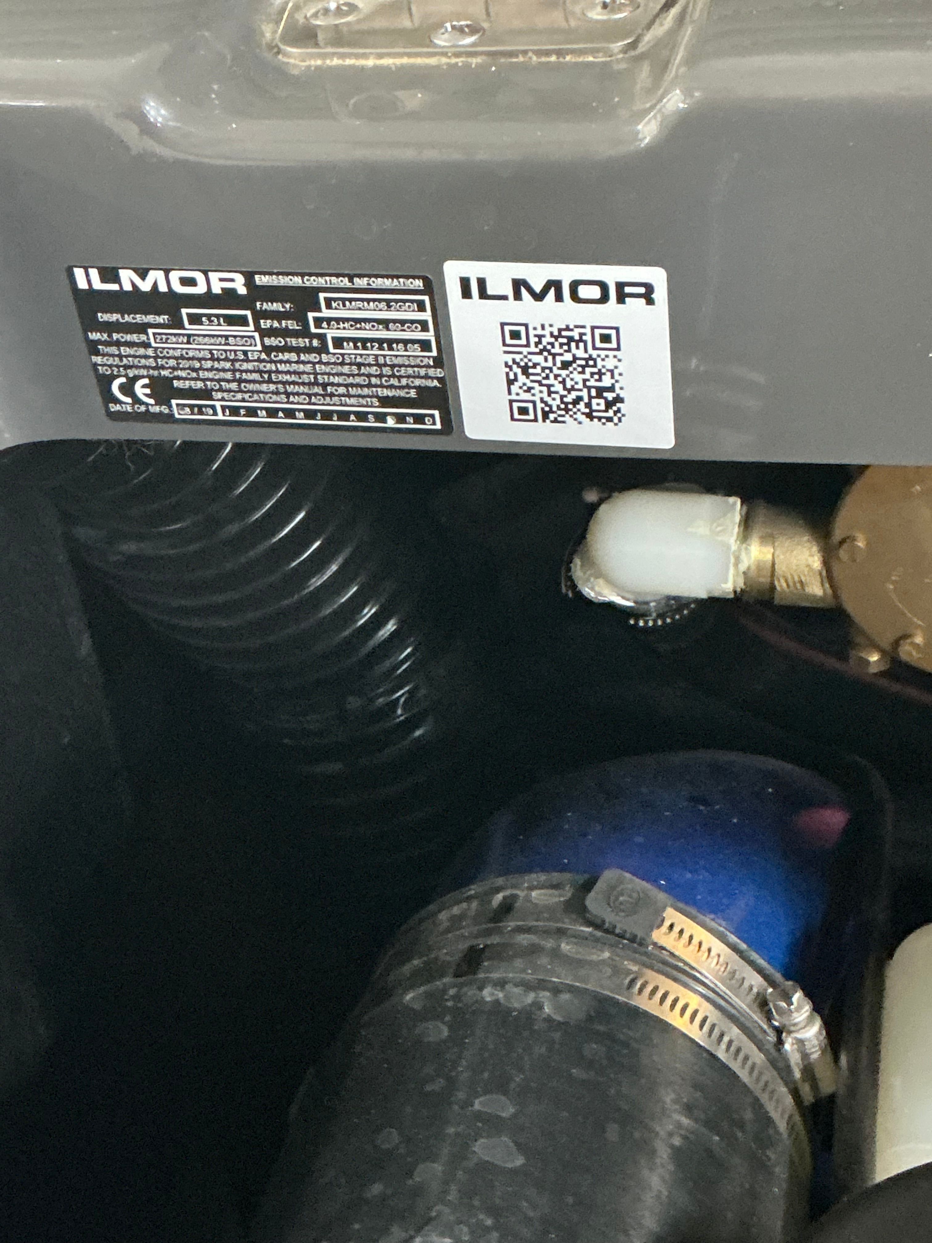 Close-up of an engine compartment featuring an Ilmor engine.