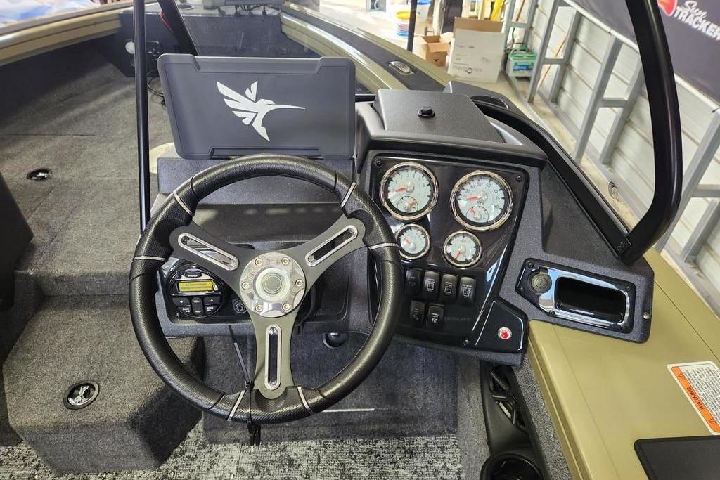2026 Tracker Targa 185 WT boat dashboard with steering wheel and instrument panel.