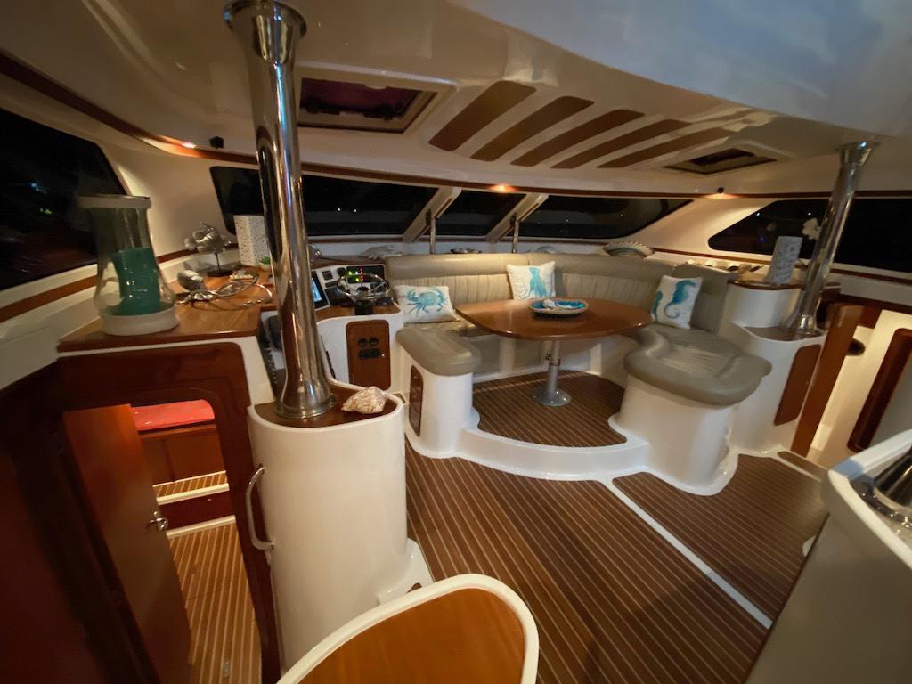 Luxurious interior of 2013 Africat Marine AfriCat PowerCat Sportfisher with elegant seating and wooden flooring.