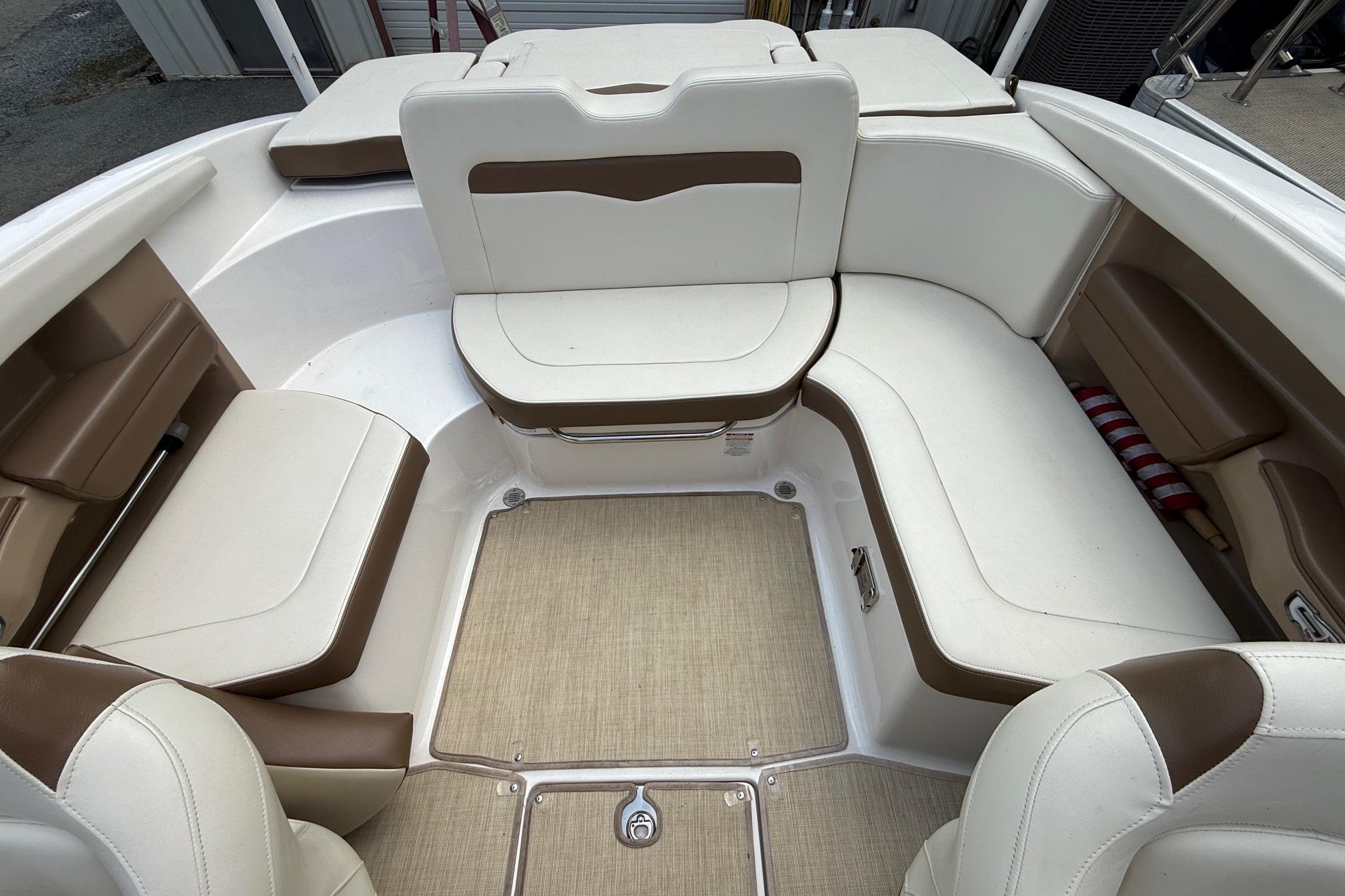 2016 Chaparral 226 SSi Wide Tech boat interior with white and brown seating.