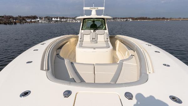 2025 Scout 425 LXF boat on calm water, featuring spacious seating and modern design.