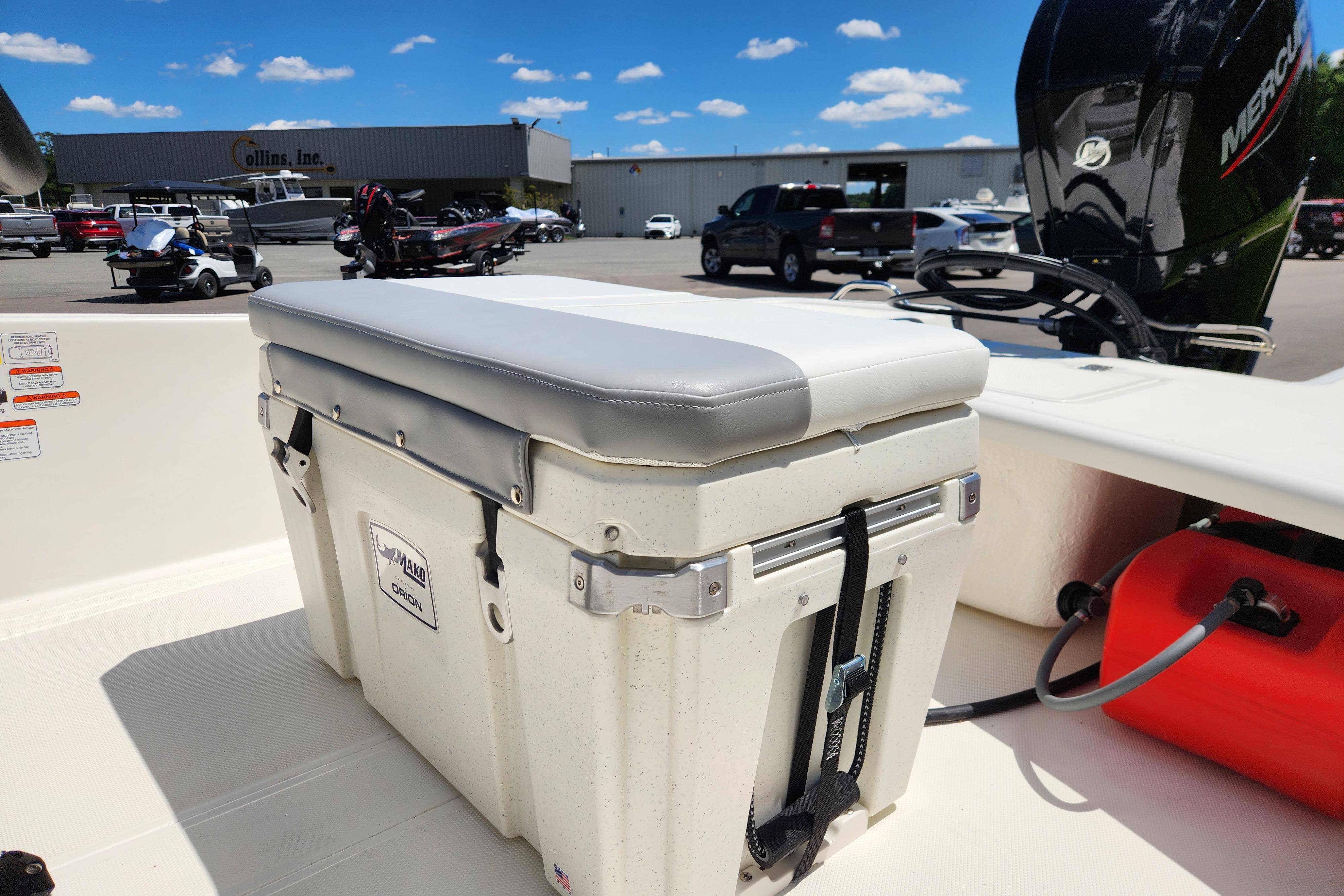 2026 Mako Pro Skiff 17 CC boat with cushioned cooler seat and Mercury engine.
