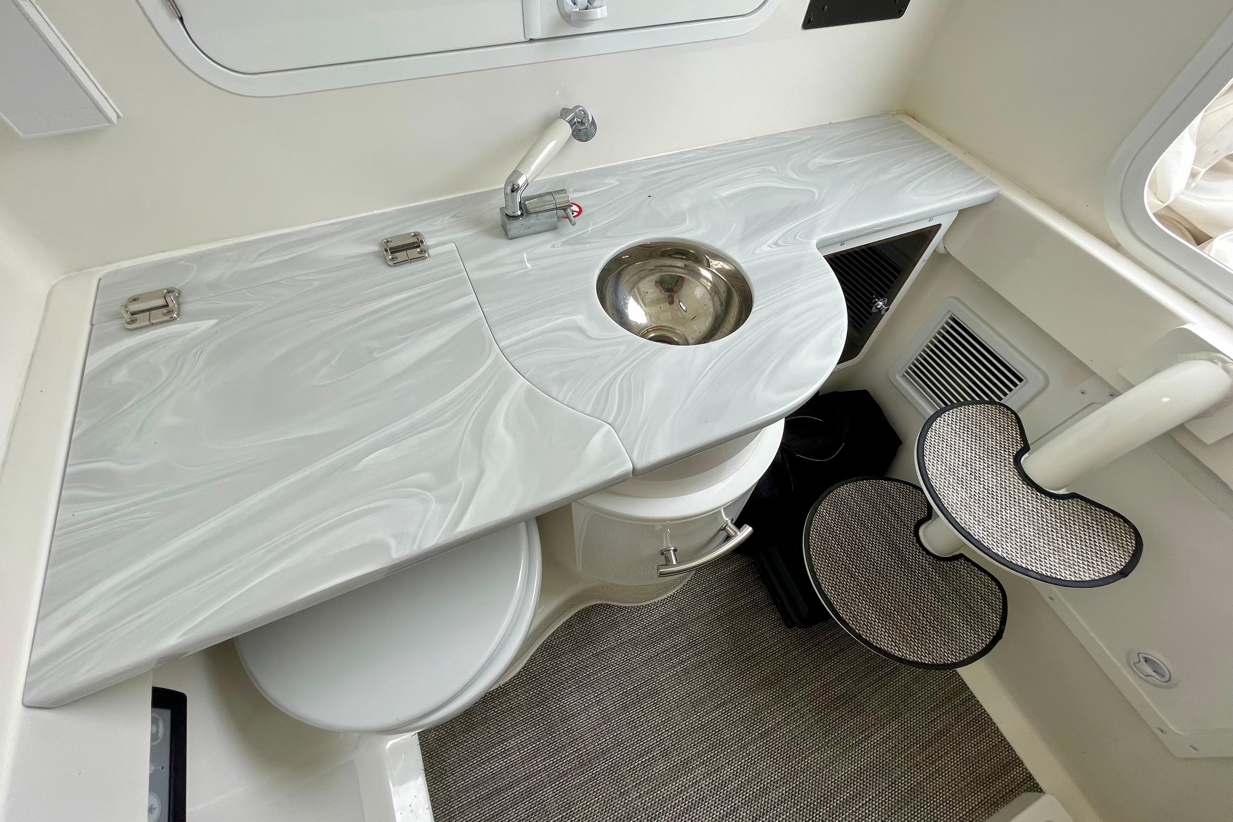 2023 Regulator 34 boat interior with sleek countertop and compact sink design.