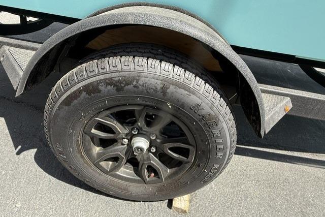 2026 Tahoe T18 trailer wheel with black alloy rim and KARRIER tire.