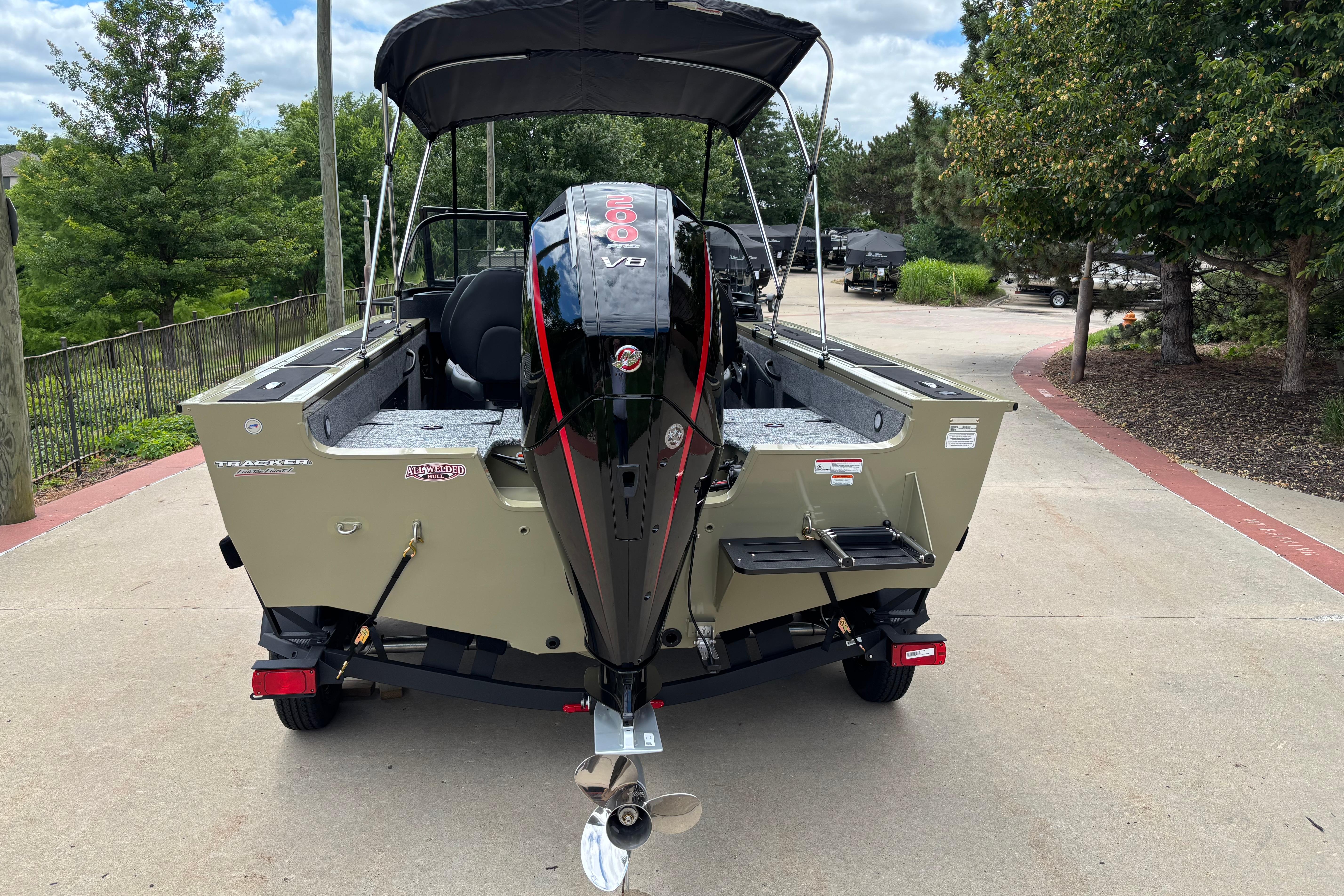 2026 Tracker Targa V-18 Combo boat with powerful V8 engine, parked outdoors.