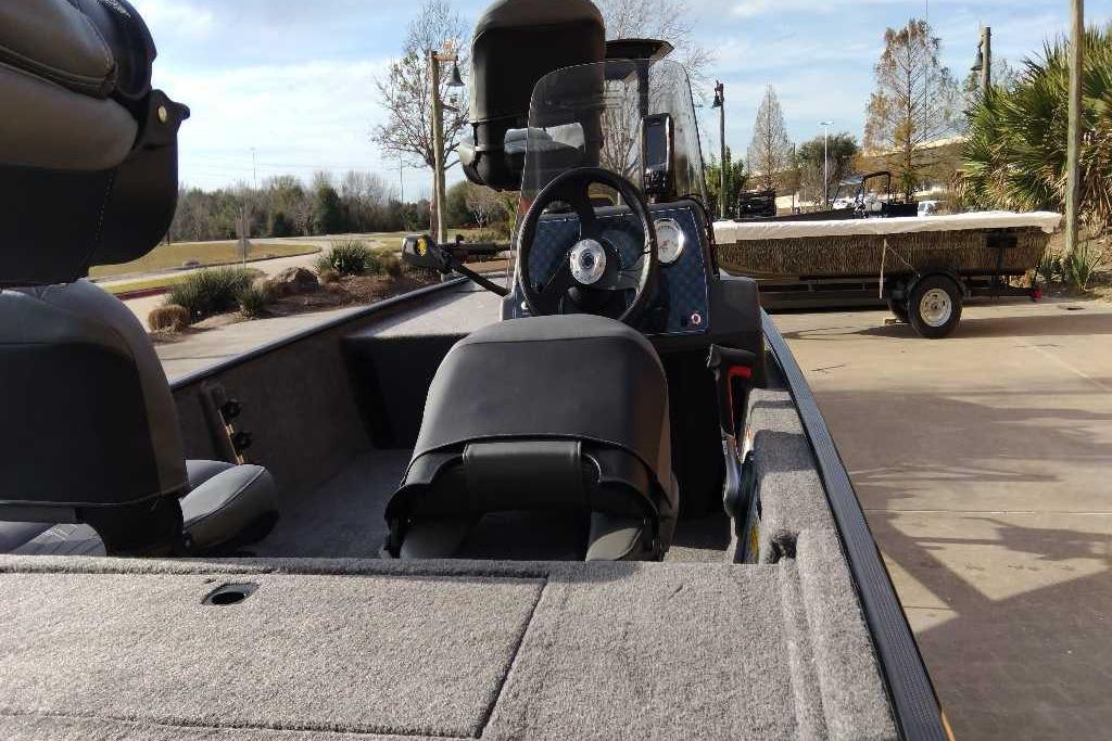 2026 Tracker Bass Tracker Classic XL boat interior with steering wheel and seating.