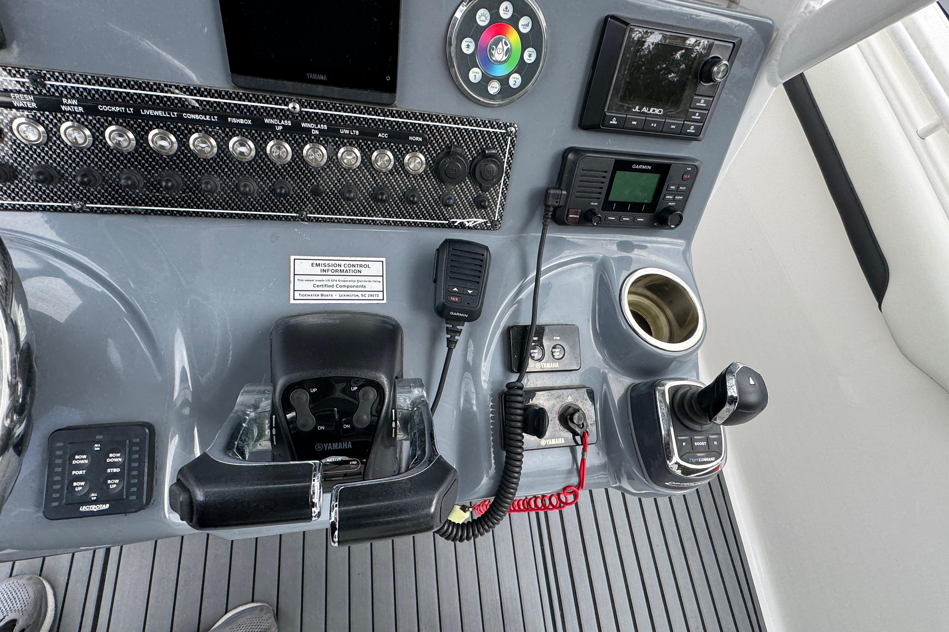 Control panel of 2021 Tidewater 280 CC Adventure boat with navigation and audio systems.