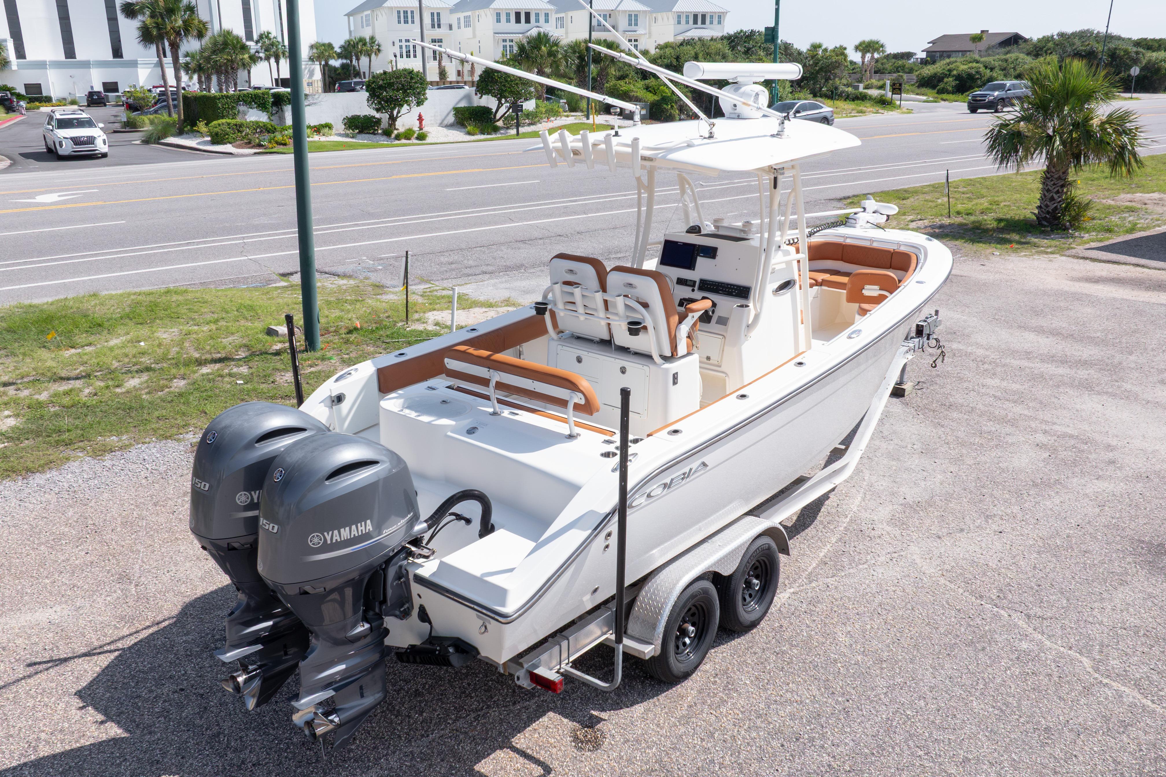 2017 Cobia 261 Center Console boat with dual Yamaha engines on a trailer.