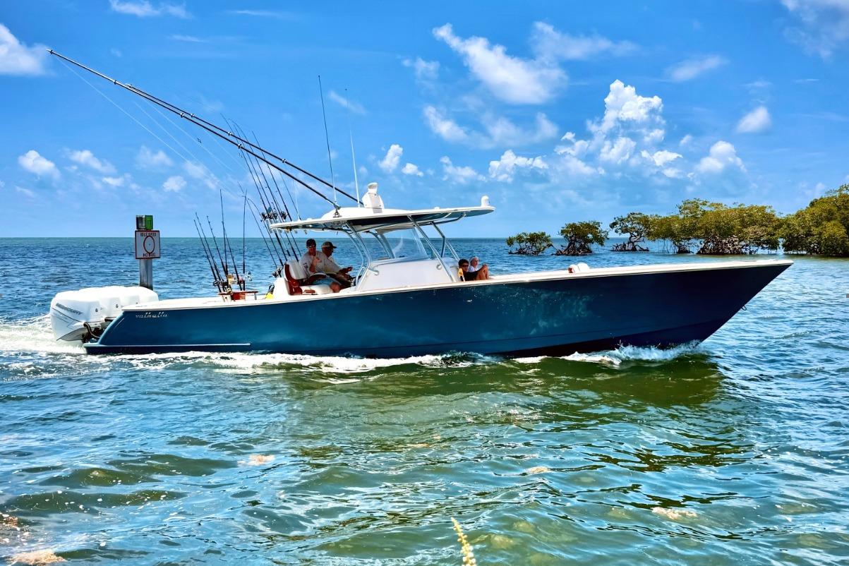 2020 Valhalla Boatworks V-41 cruising on clear blue waters under a sunny sky.