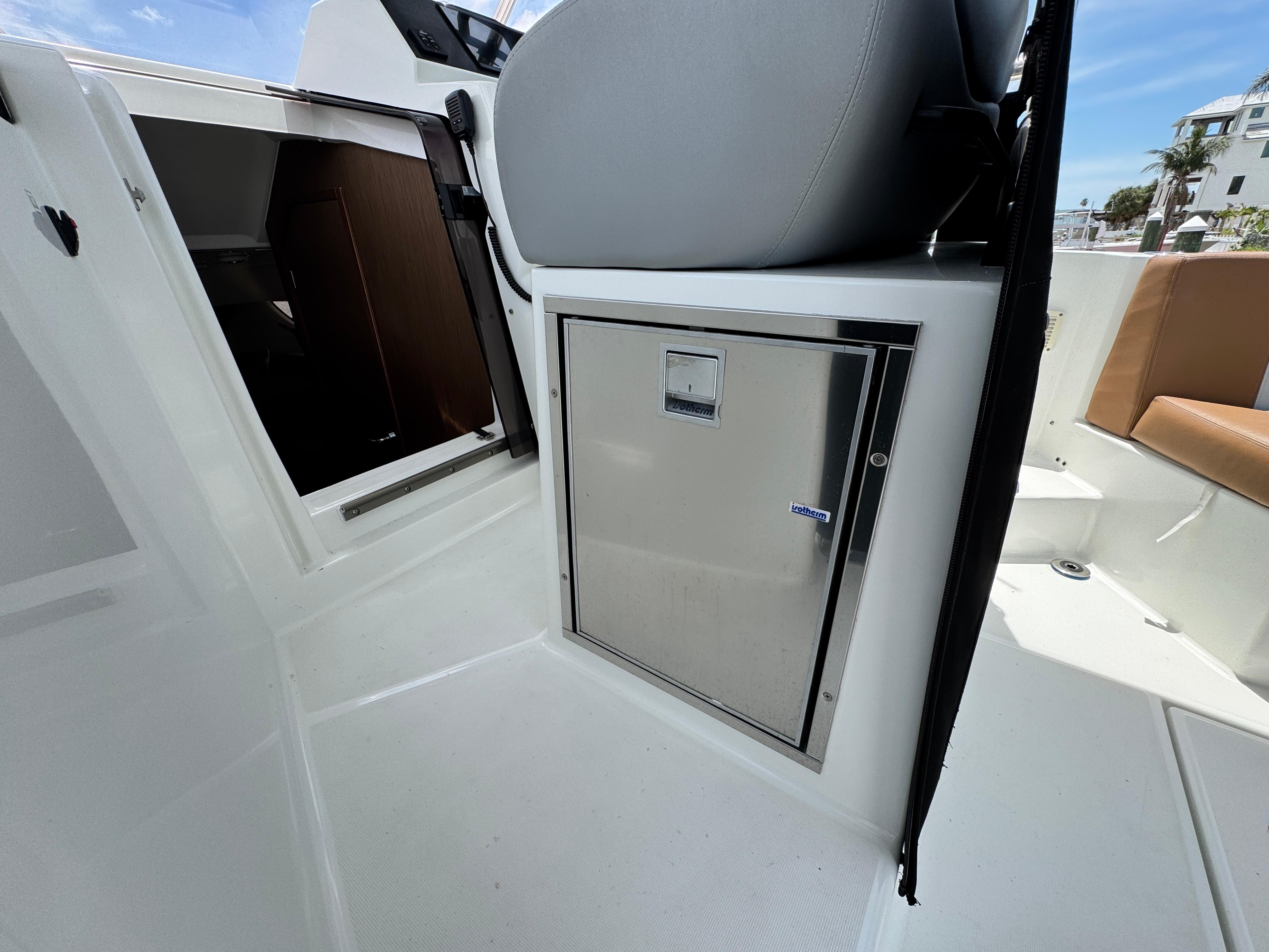 2022 Beneteau Flyer 9 SUNdeck interior with seating and storage compartment.