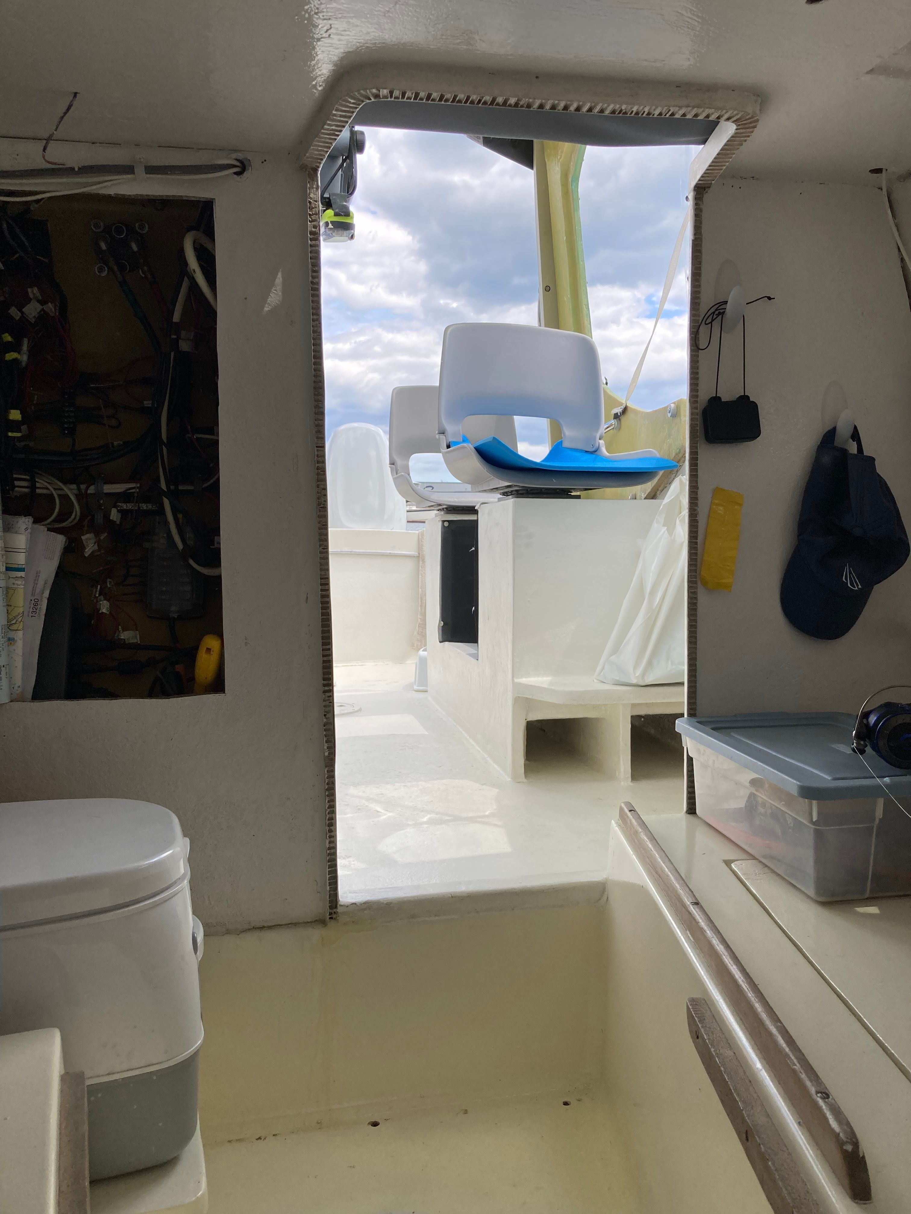 Interior view of a 1969 Bertram Bahia Mar with seating area and toilet.