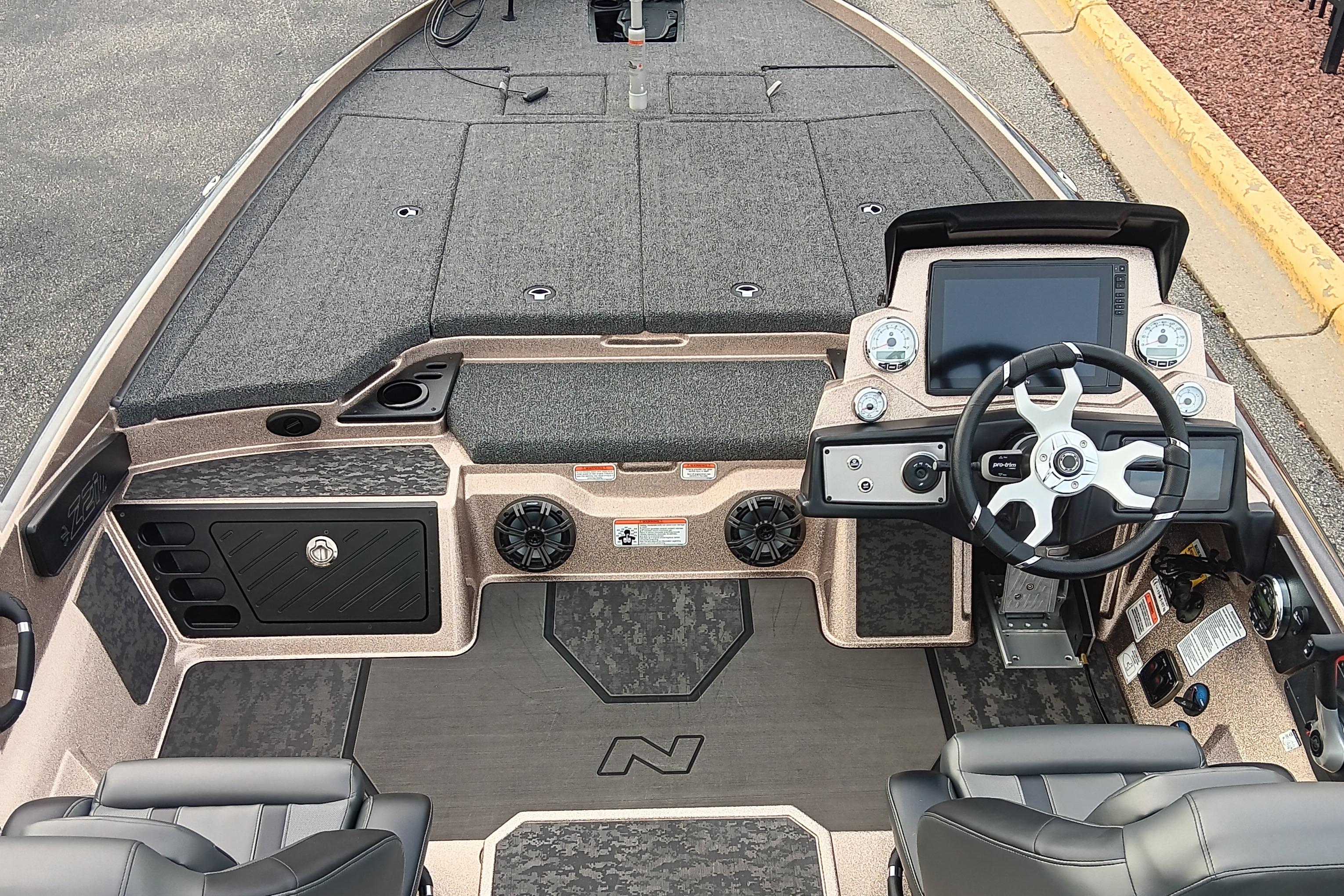 2026 Nitro Z21 XL Pro boat interior with steering wheel, dashboard, and seating.