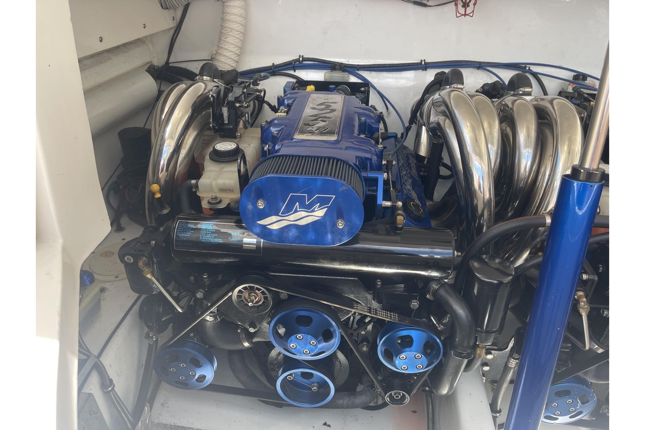 High-performance engine of a 2006 Sonic 386 boat, featuring blue accents and polished components.