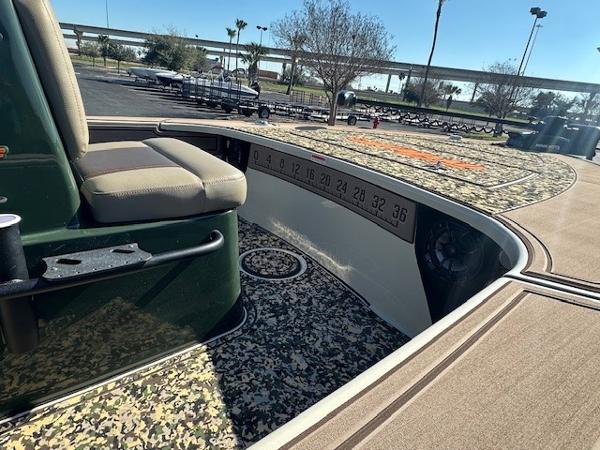 2025 Mako 18 Pro Skiff Backwater Edition with camo interior and measuring ruler.