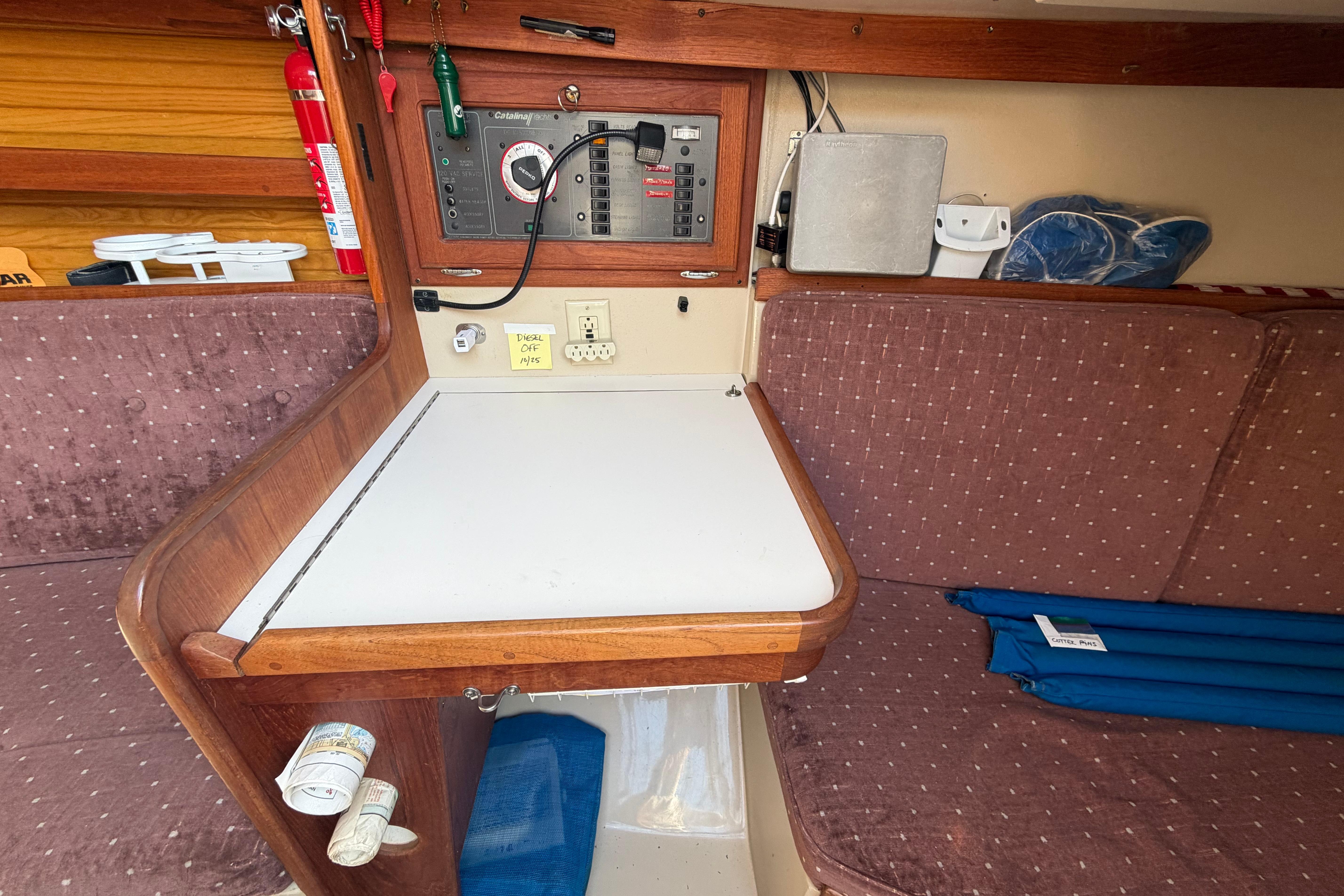 Interior of a 1988 Catalina 30 MkII sailboat with navigation station and seating area.