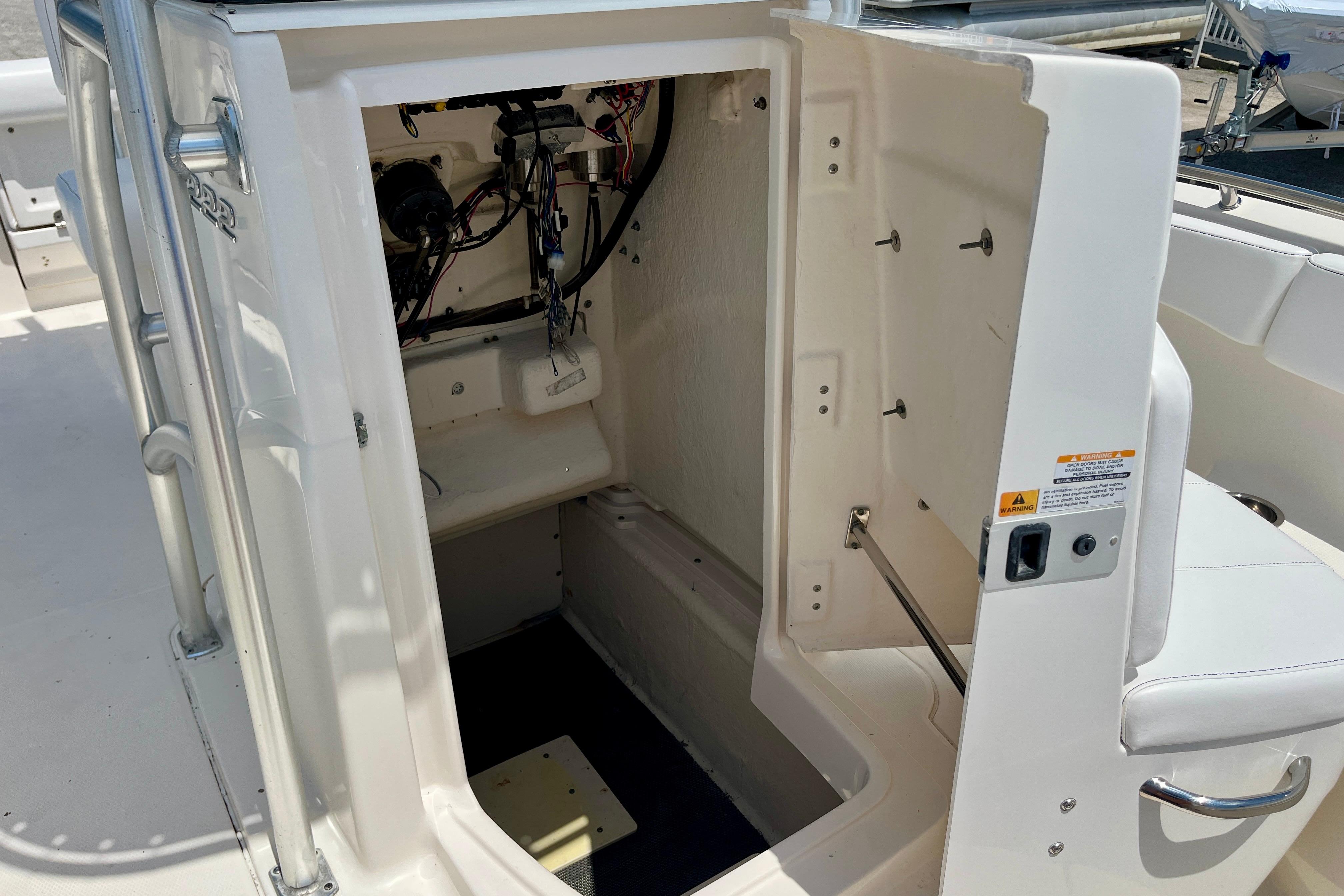 2016 Robalo R222 Center Console boat interior storage compartment with wiring visible.