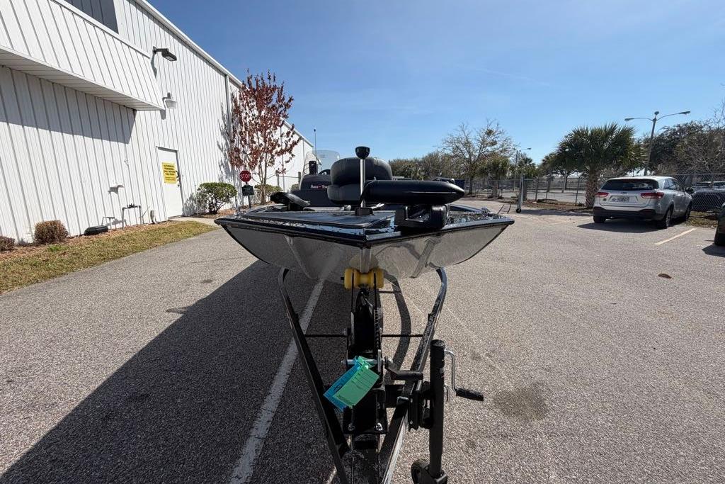 2026 Tracker Bass Tracker Classic XL boat on trailer in parking lot.