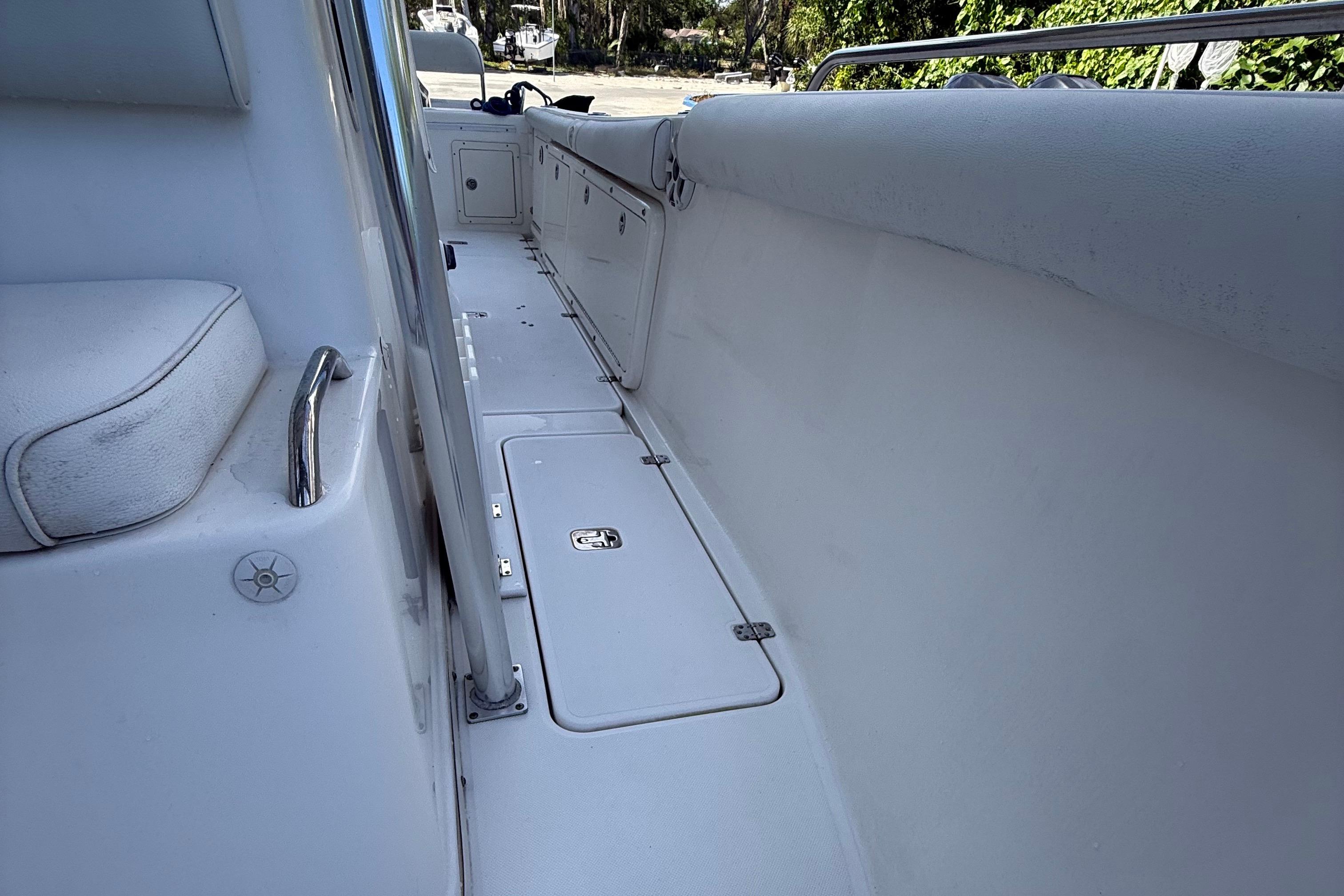 2008 Century 2901 Center Console boat interior with seating and storage compartments.