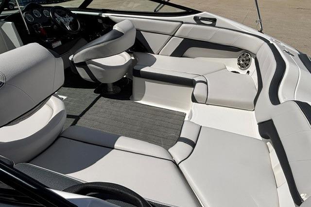 Interior of 2014 Yamaha Boats 212X, featuring sleek seating and modern dashboard design.
