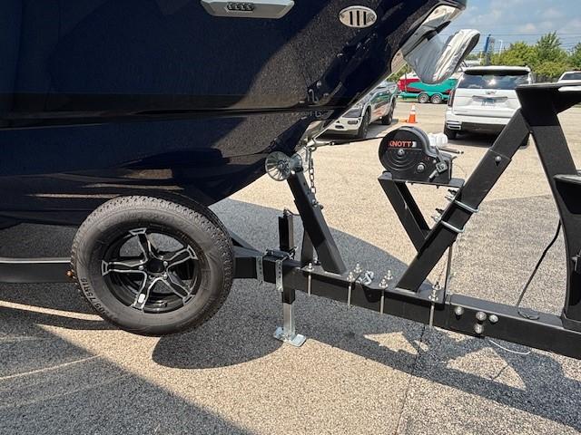 2026 Chaparral SSX 6 boat on trailer, featuring black wheel and hitch mechanism.