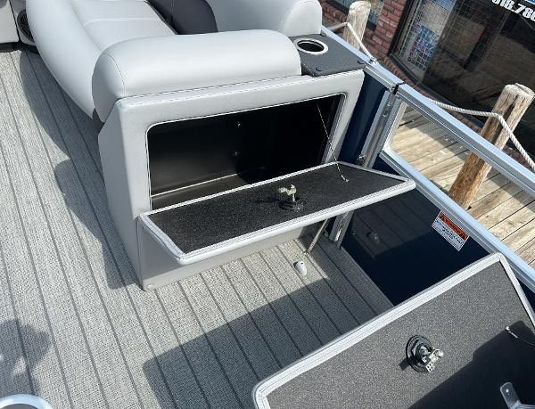 2024 Landau ATLANTIS 230C boat with open storage compartment.