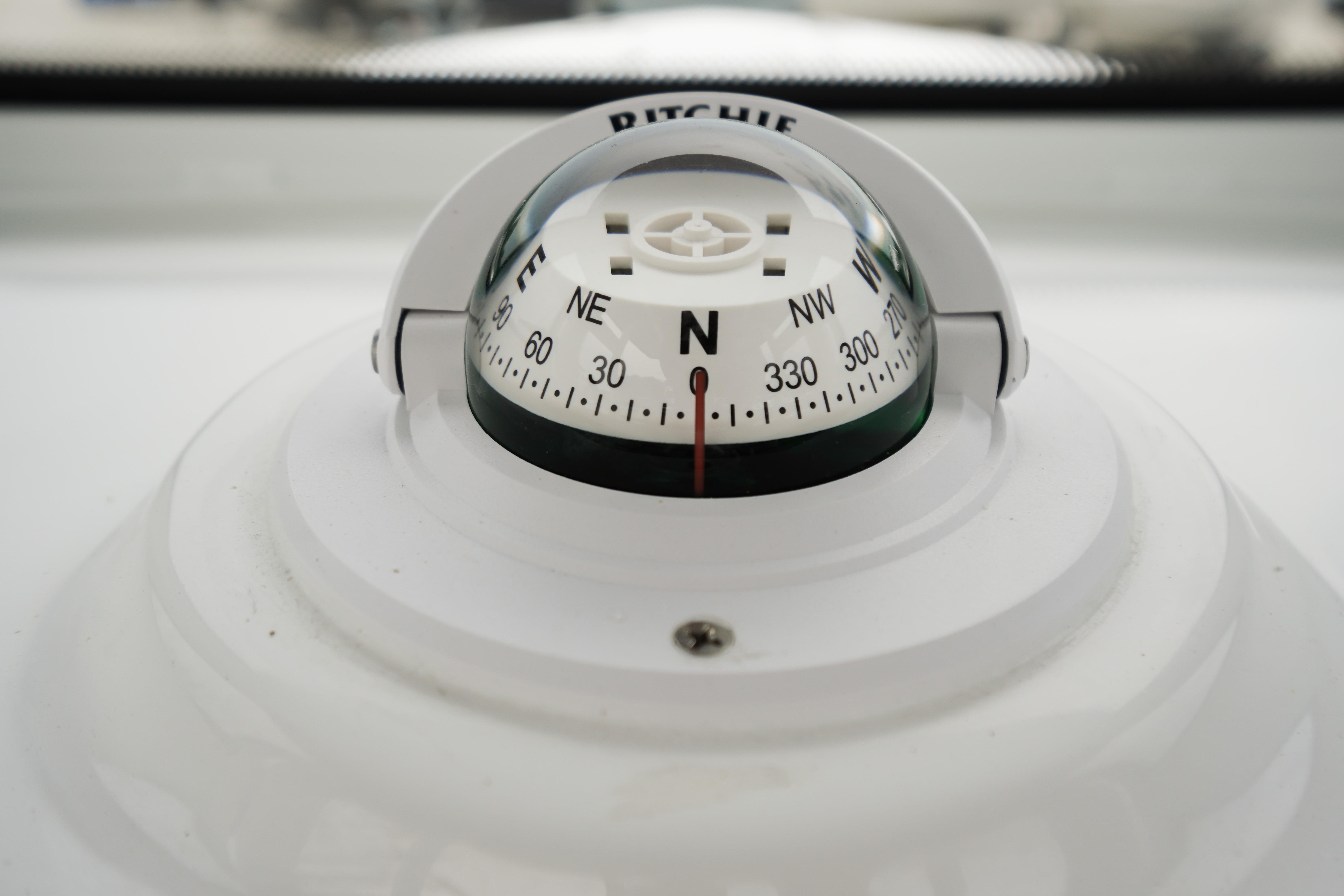 Compass on 2026 Tidewater 232 SS boat, showing north direction.
