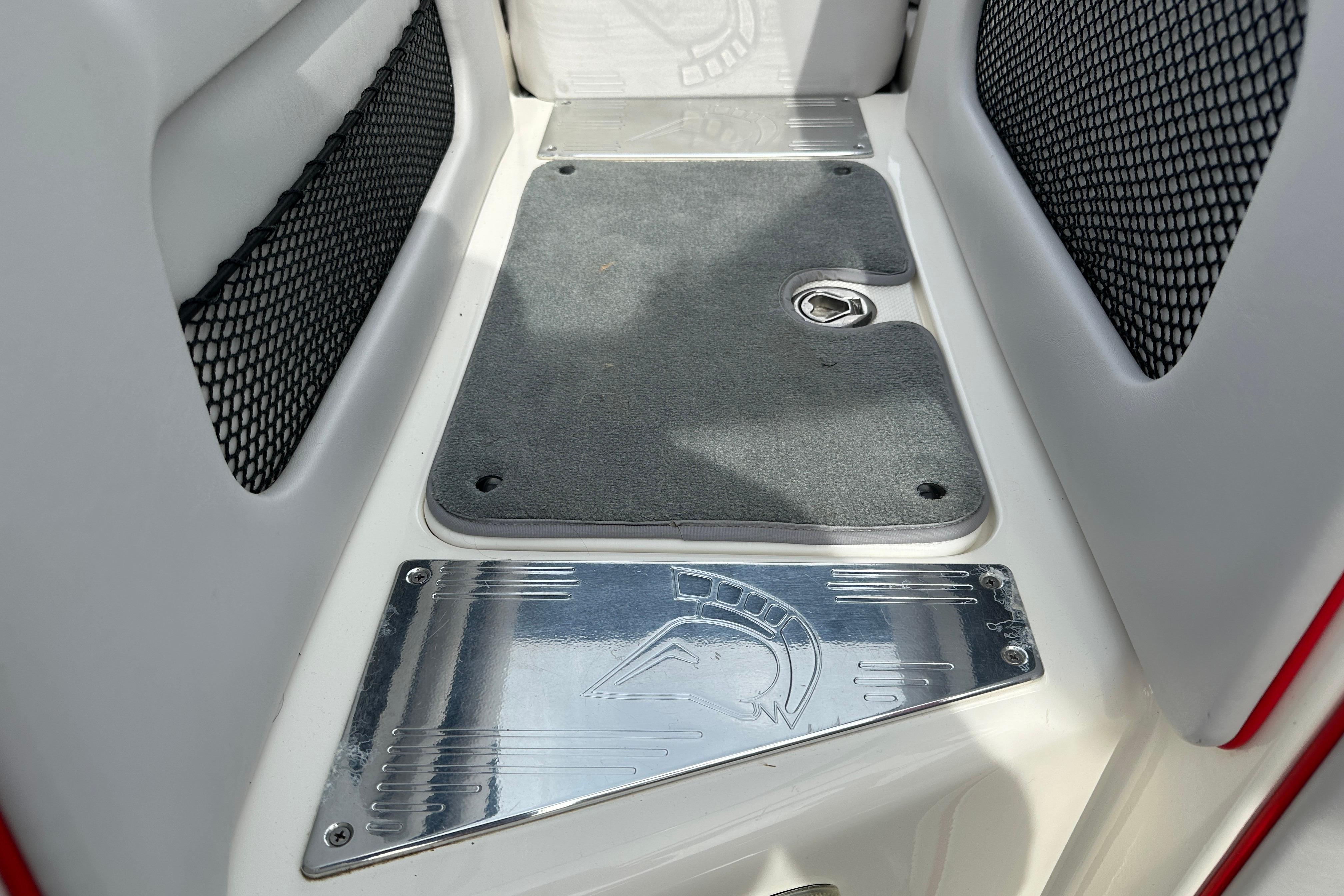 2008 Centurion Enzo SV240 boat interior with metal and carpeted flooring details.