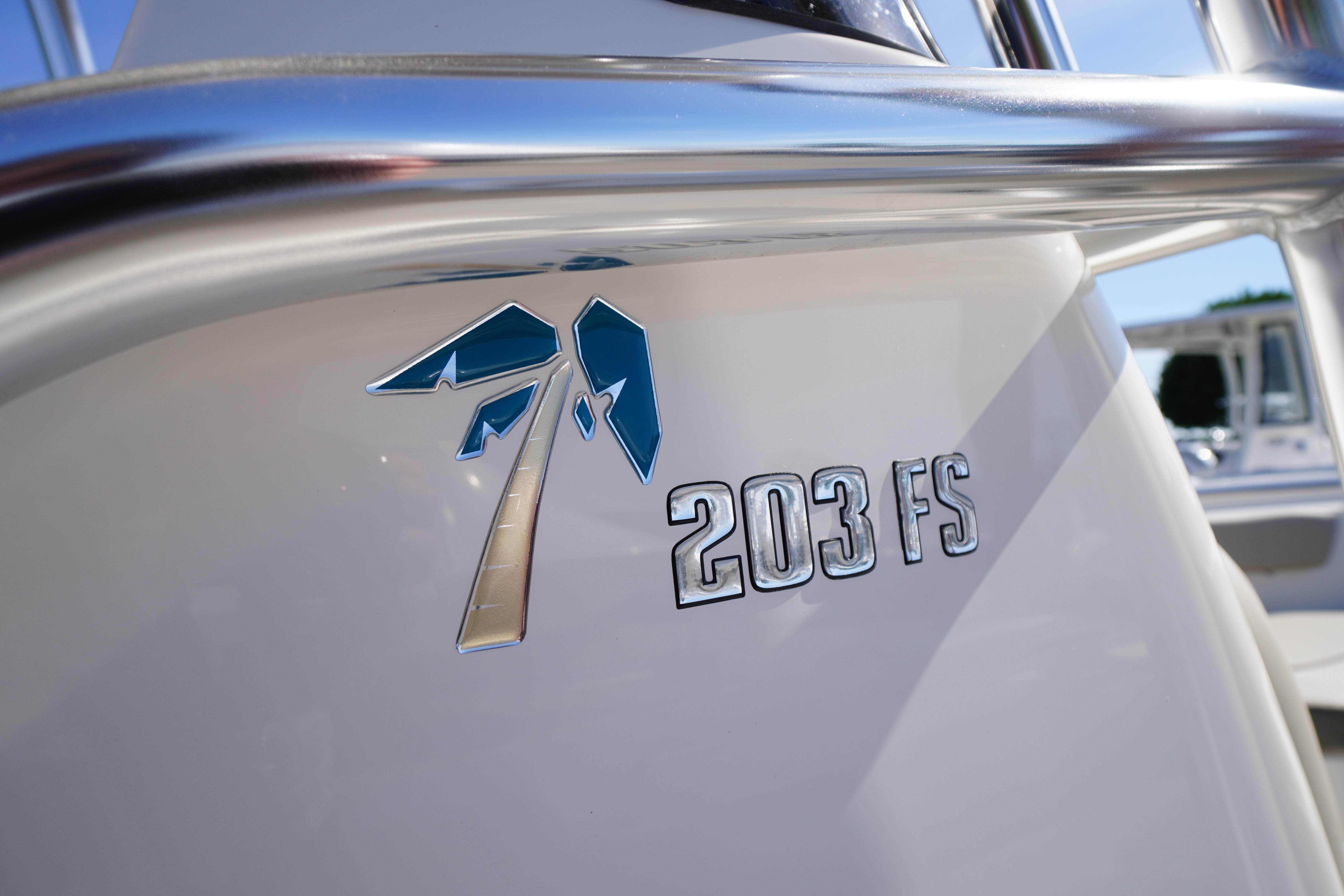 2025 Key West 203 FS boat emblem with sleek design and metallic finish.