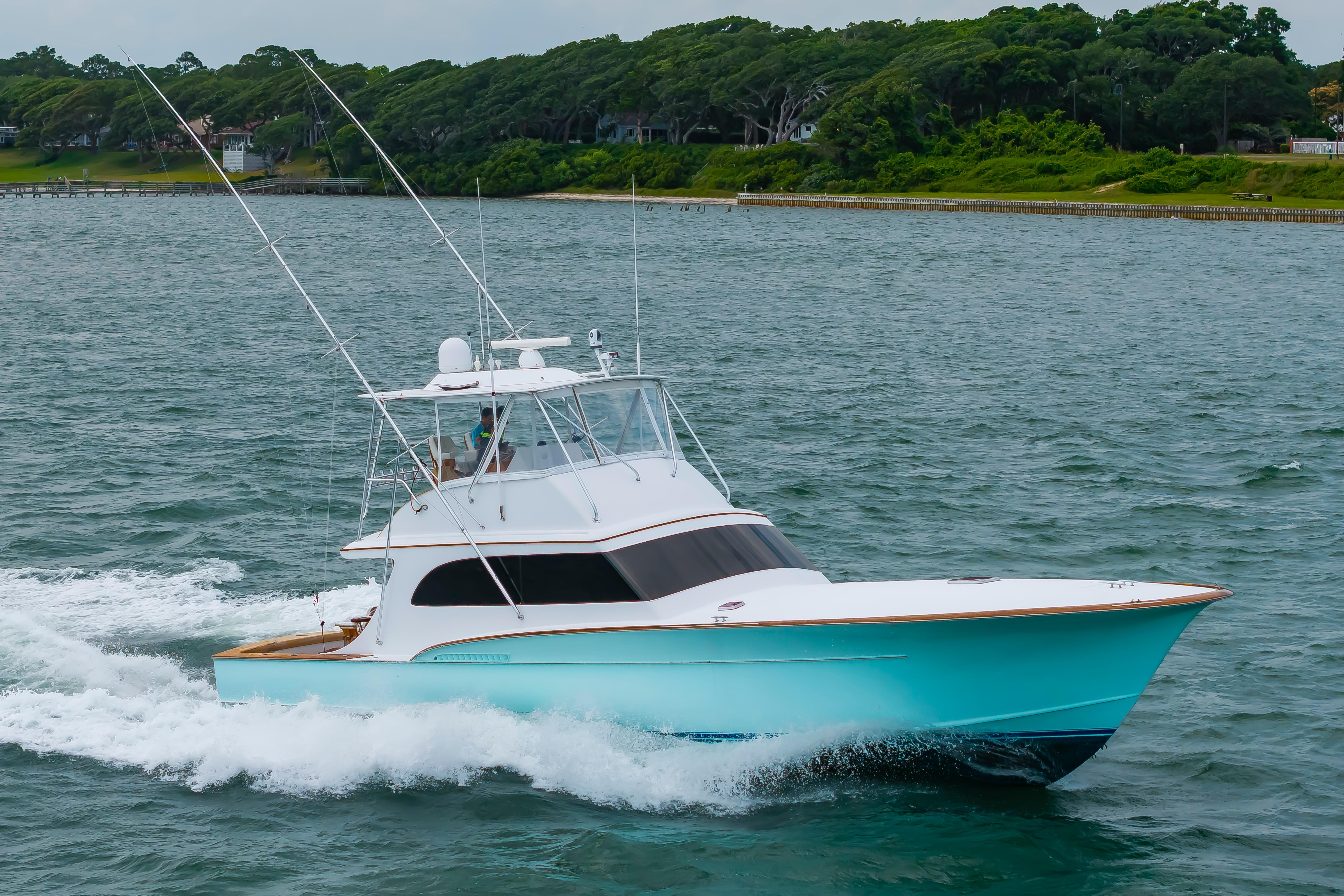 Custom Carolina Scarborough 56 Convertible yacht cruising on water, 1993 model.