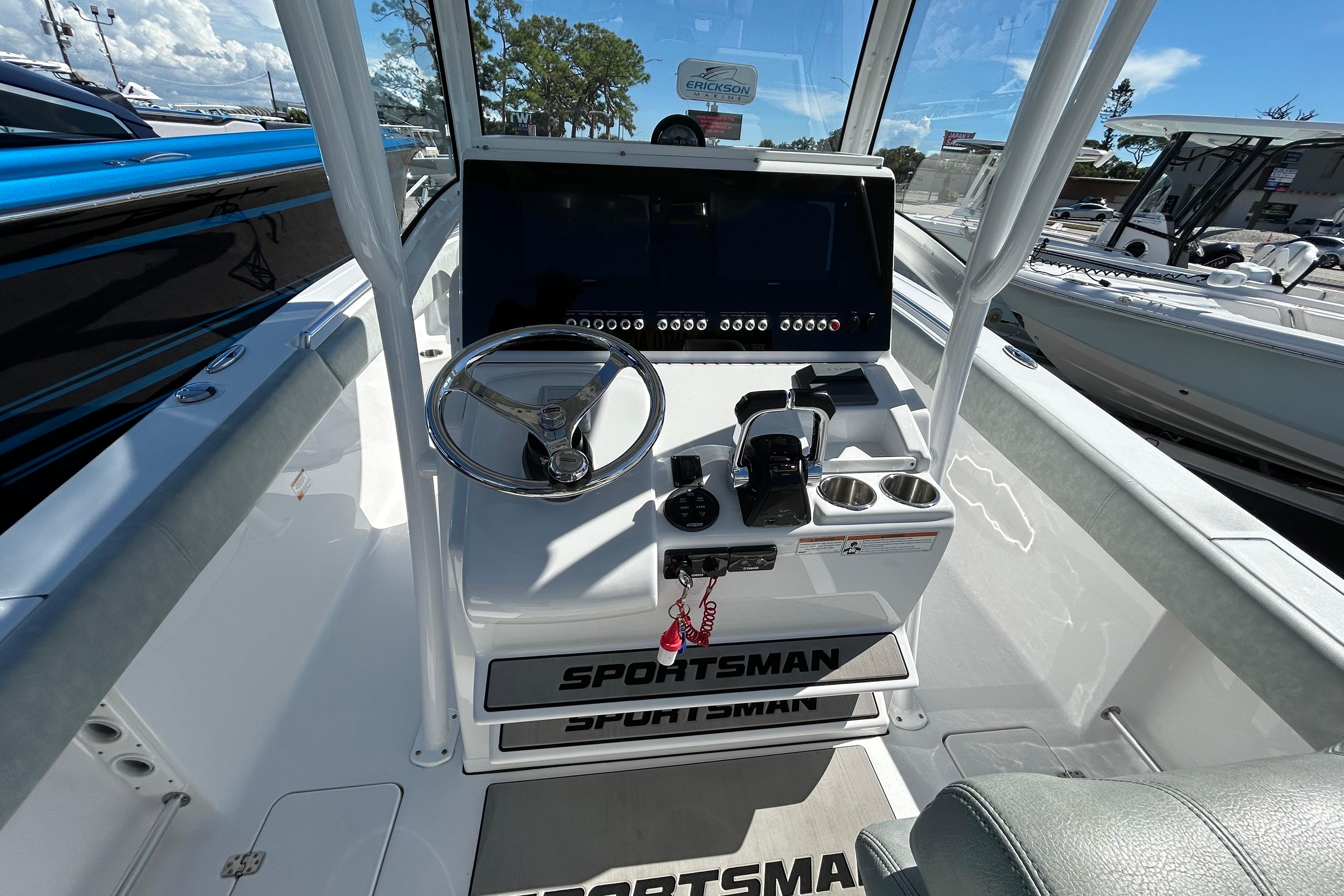 2019 Sportsman Open 282 Center Console boat dashboard with steering wheel and controls.