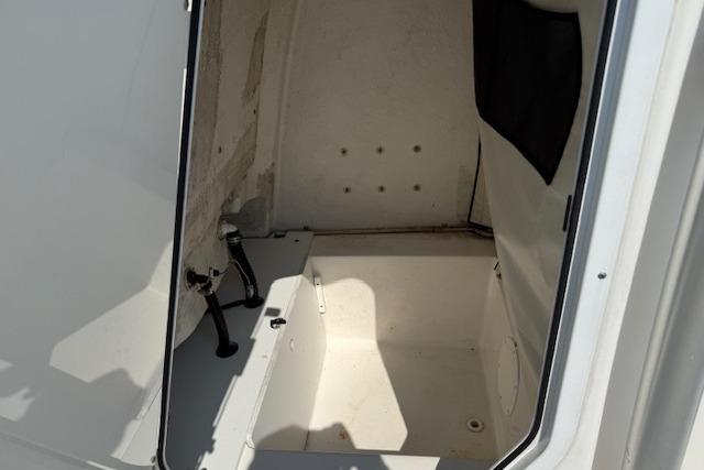 2016 Sea Fox 240 Viper boat interior compartment, featuring clean white surfaces and storage space.