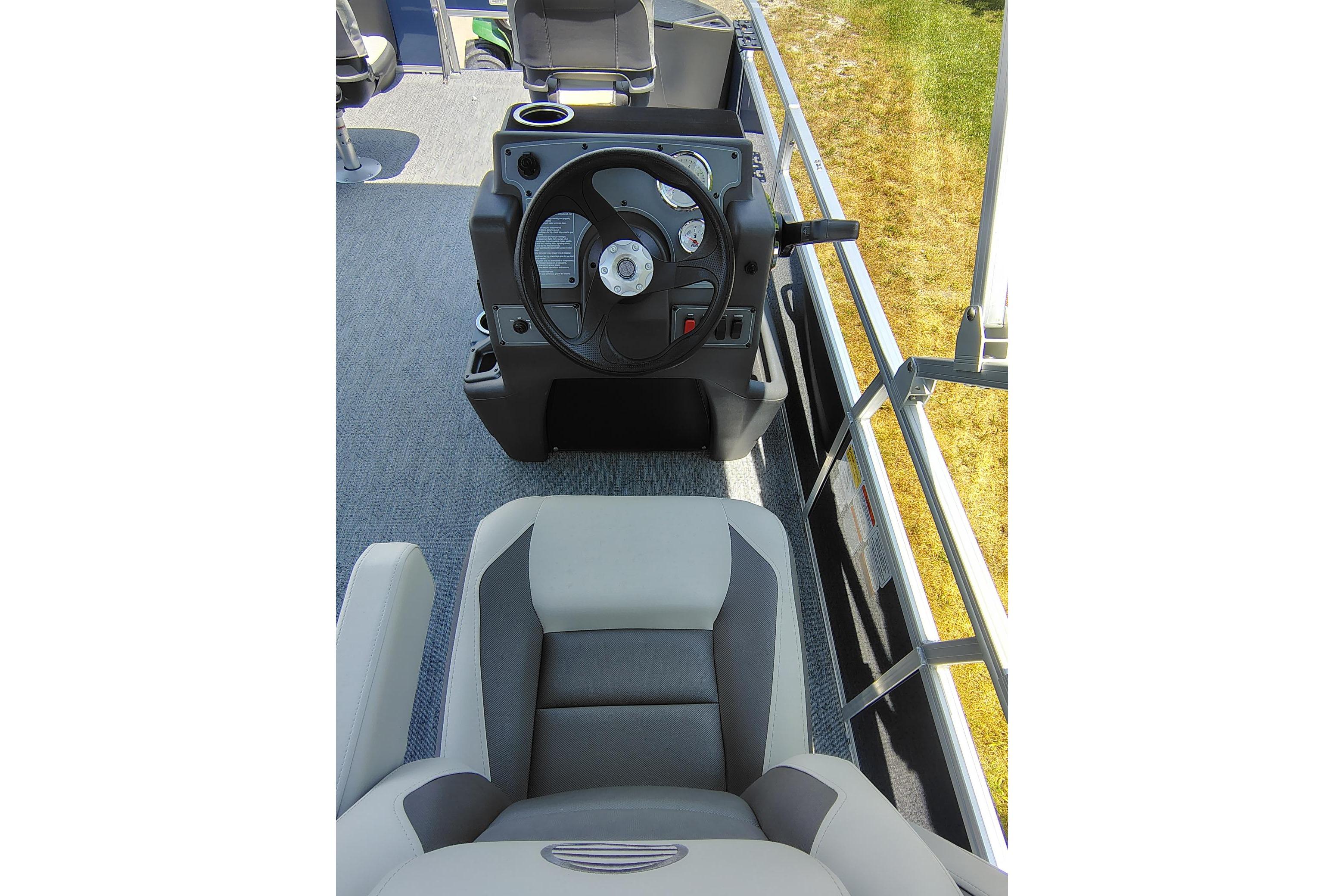 2026 Sun Tracker Bass Buggy 18 DLX interior with steering wheel and seating.