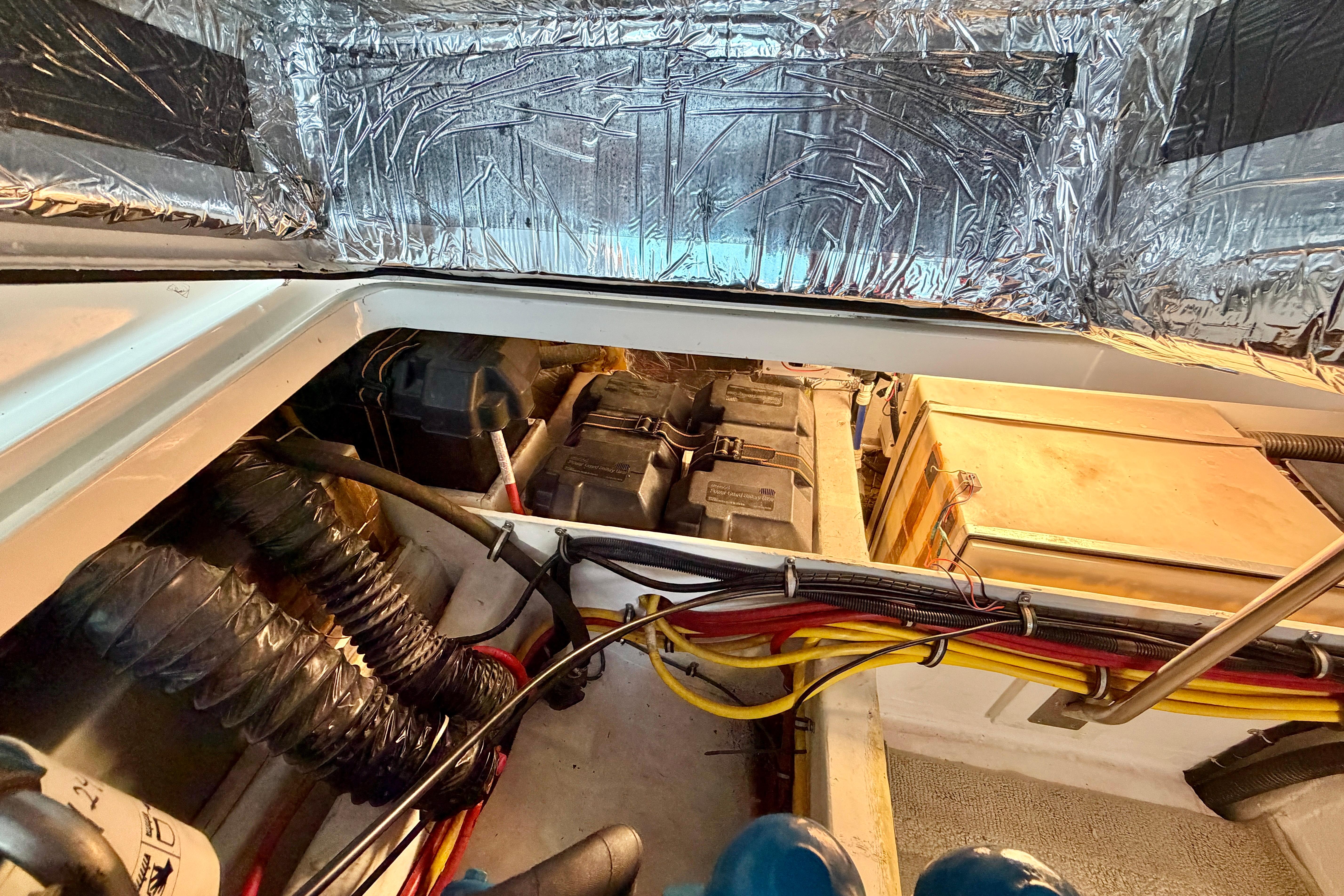 Engine compartment of a 1999 Tiara Yachts 2900 Coronet with wiring and insulation.