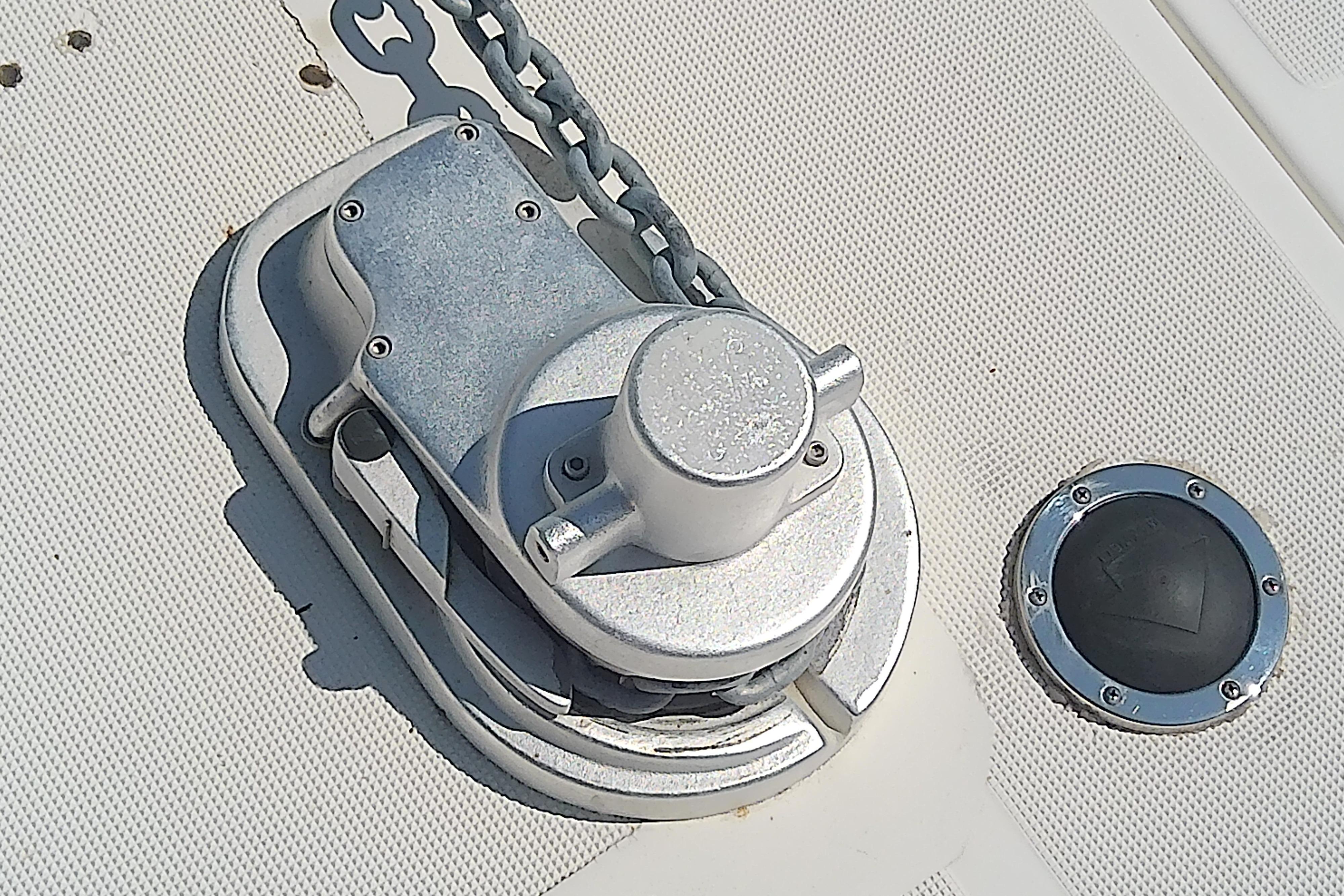 Anchor windlass on 2000 Tiara Yachts 4100 Open deck, with chain and deck fitting.