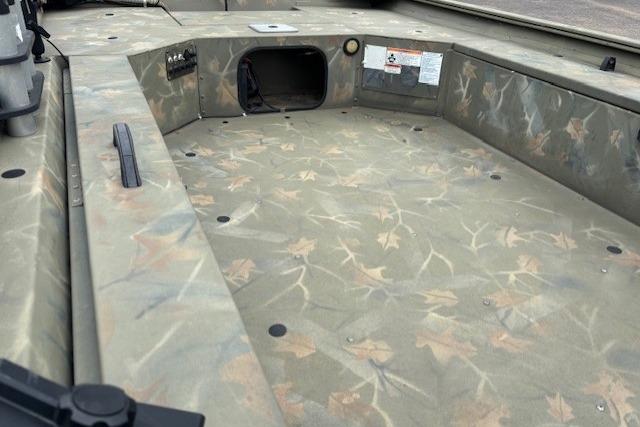 2017 Tracker Grizzly 1654 MVX Sportsman boat interior with camouflage pattern.