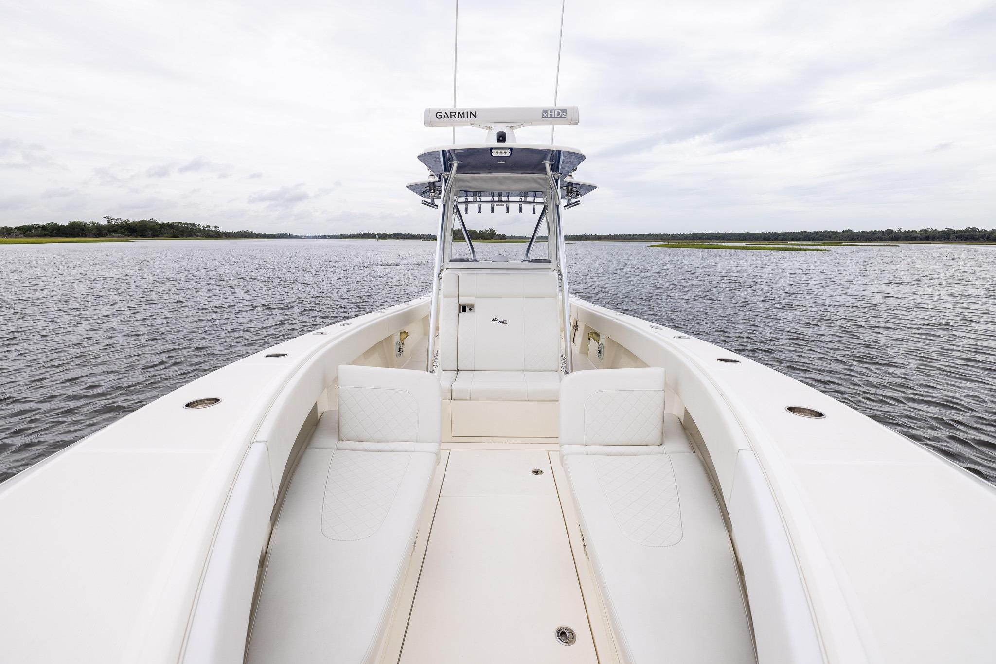 2019 SeaVee 322Z boat on calm water, featuring spacious deck and modern design.