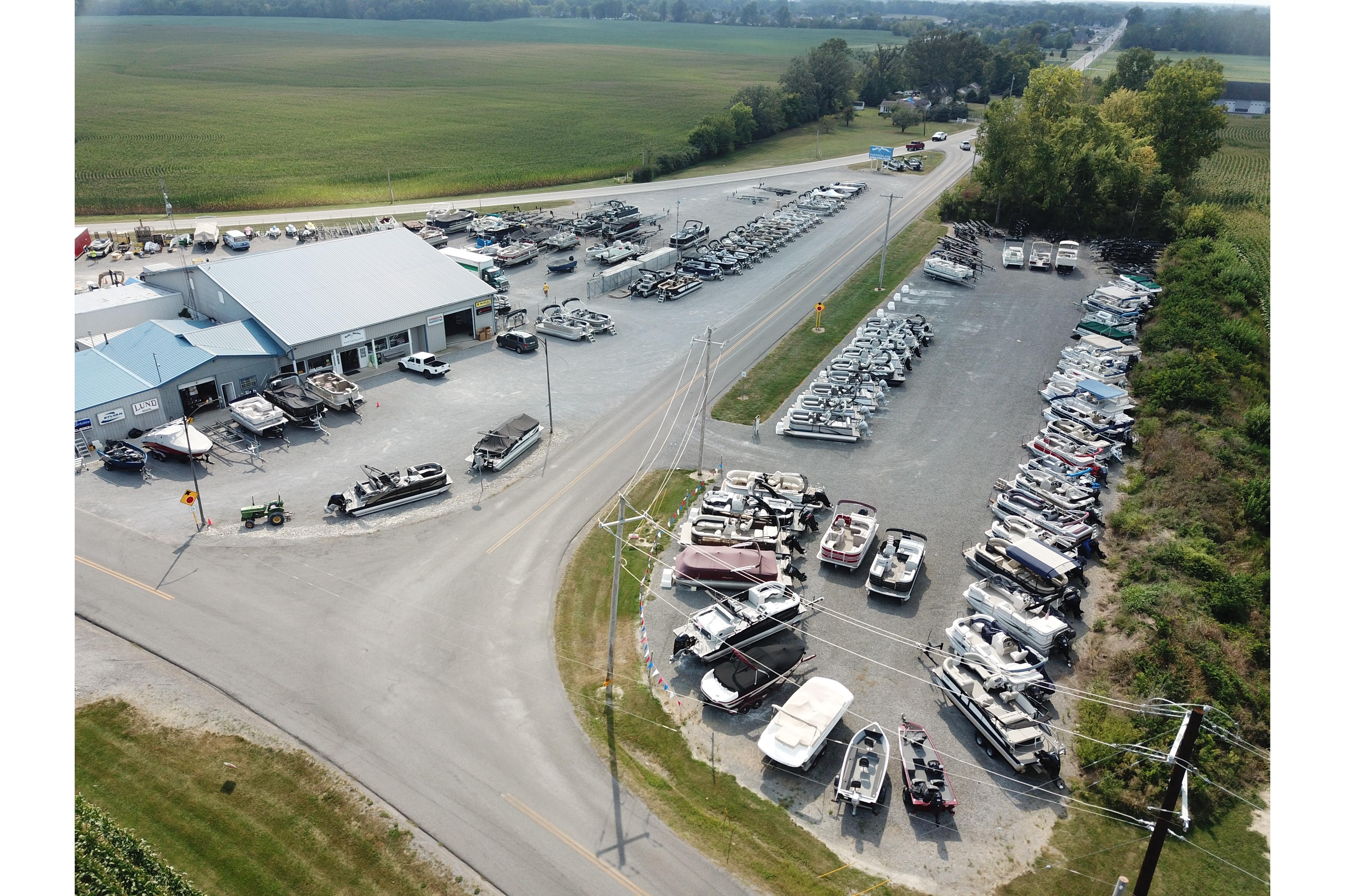 Aerial view of a boat dealership showcasing various boats, including the 2026 Barletta Aria 20L.