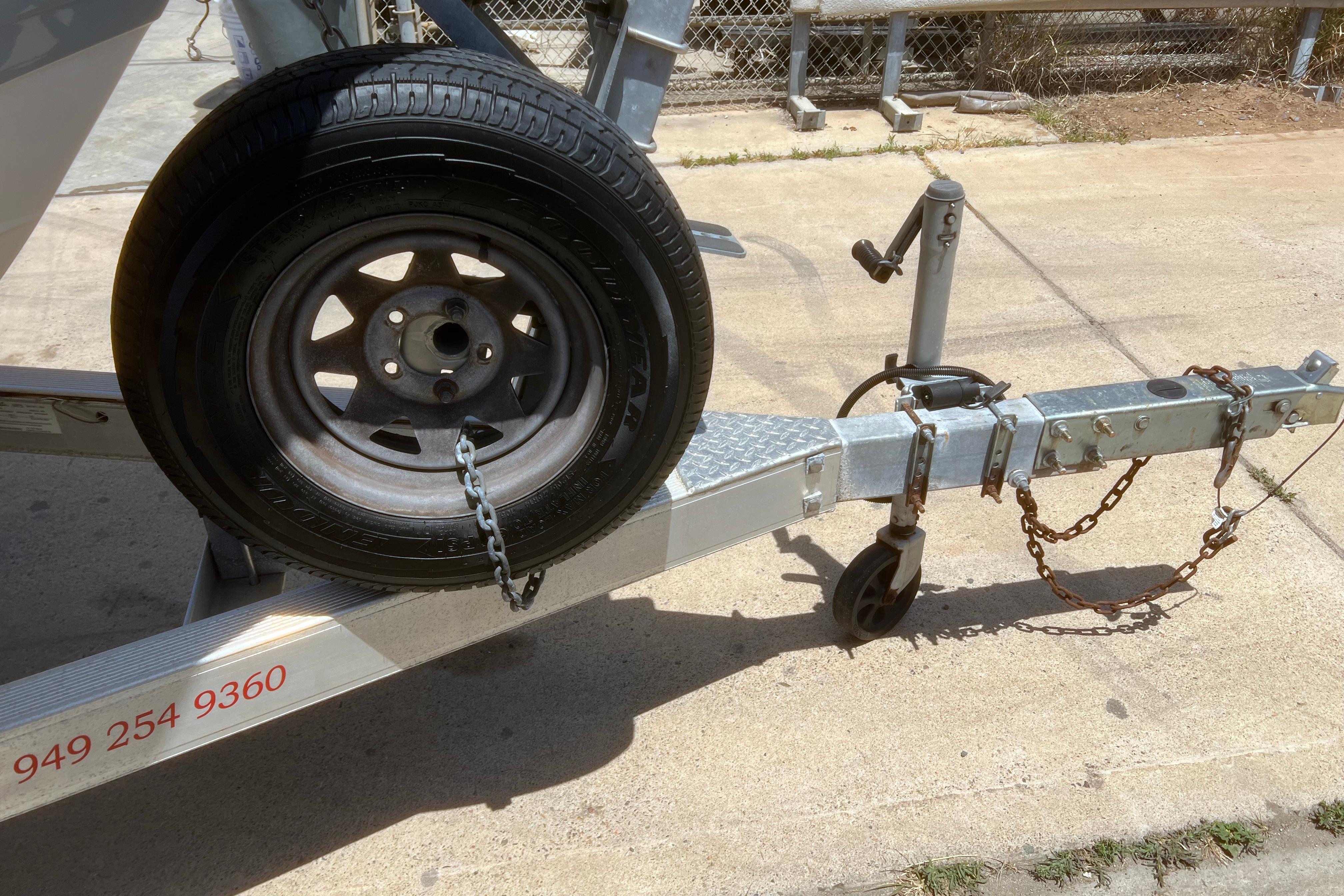 Trailer hitch with spare tire for 2018 Cobia 201 Center Console boat.