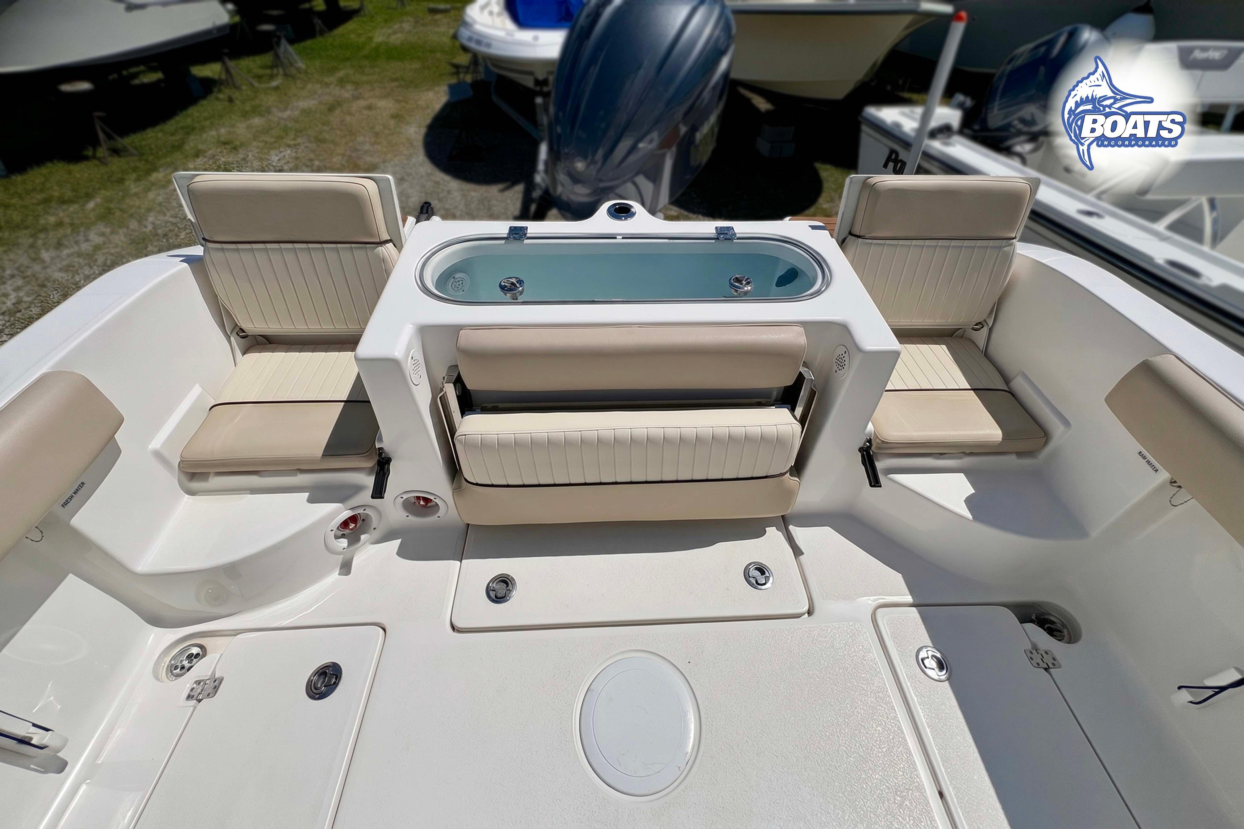 2015 Sea Fox 266 Commander boat interior with seating and storage compartments.