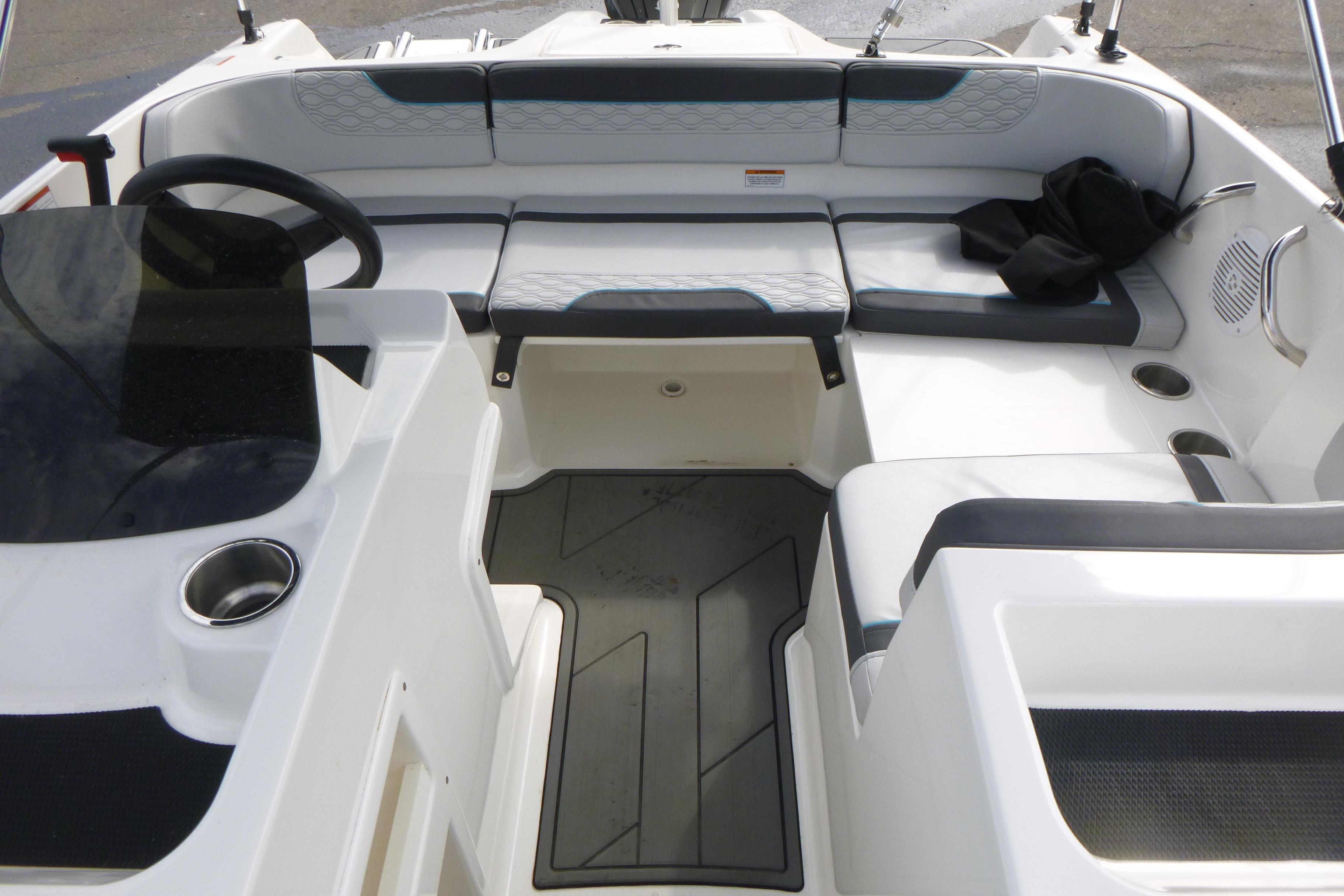 2022 Bayliner Element M17 boat interior with seating and steering wheel.