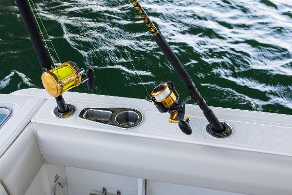 Manufacturer Provided Image: 2024 Boston Whaler 230 Outrage fishing rods and holders on boat deck.