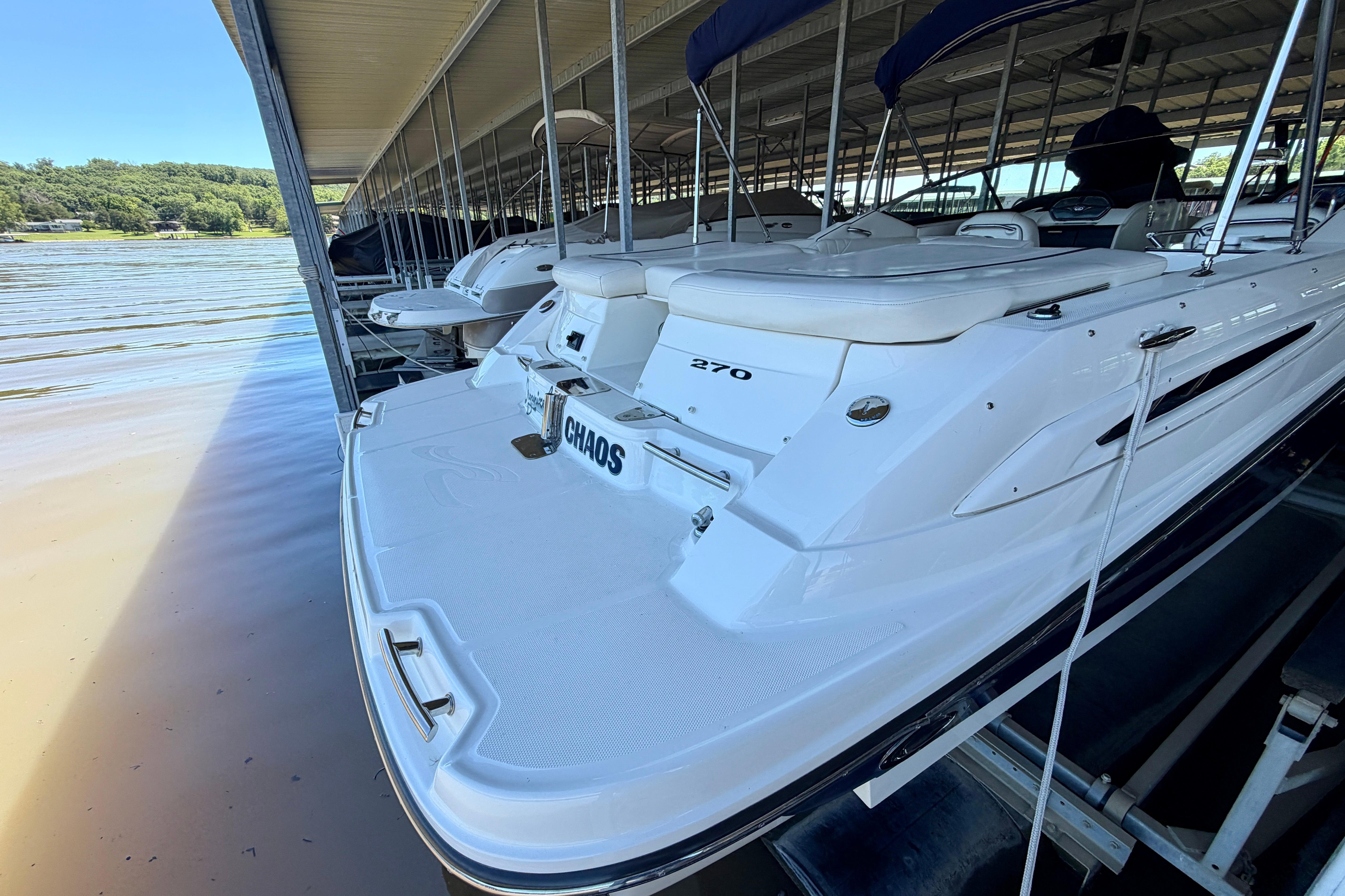 2007 Sea Ray 270 SLX boat docked in a marina, rear view.