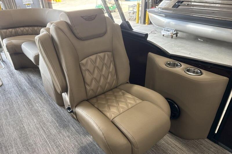 Luxurious seating in the 2026 Bennington 24 LXS Quadbench pontoon boat interior.