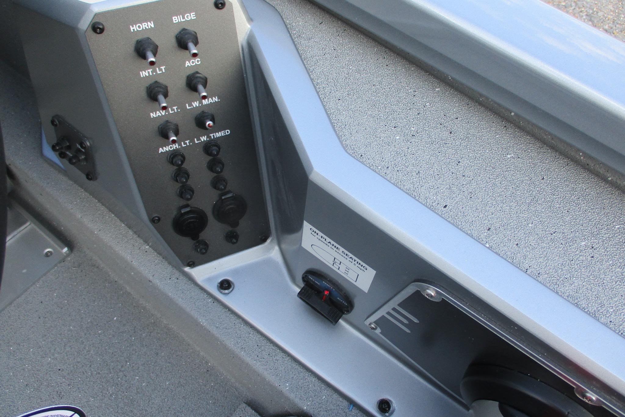 Control panel of 2026 Vexus AVX2080 boat with switches and labels.