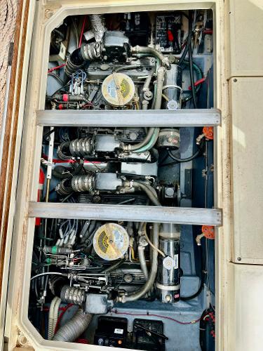 Engine compartment of a 1987 Sea Ray 270 Sundancer boat, showcasing dual engines.