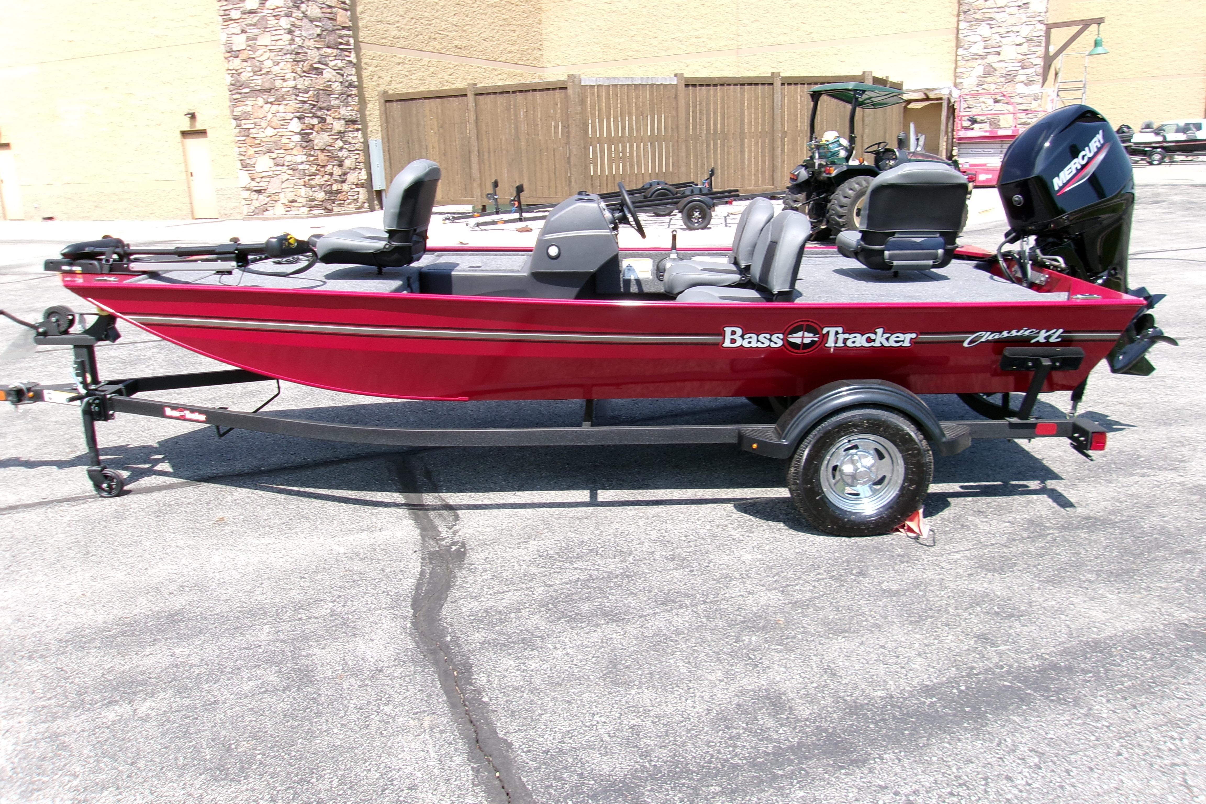 2026 Tracker Bass Tracker Classic XL boat on trailer, red exterior, parked outdoors.