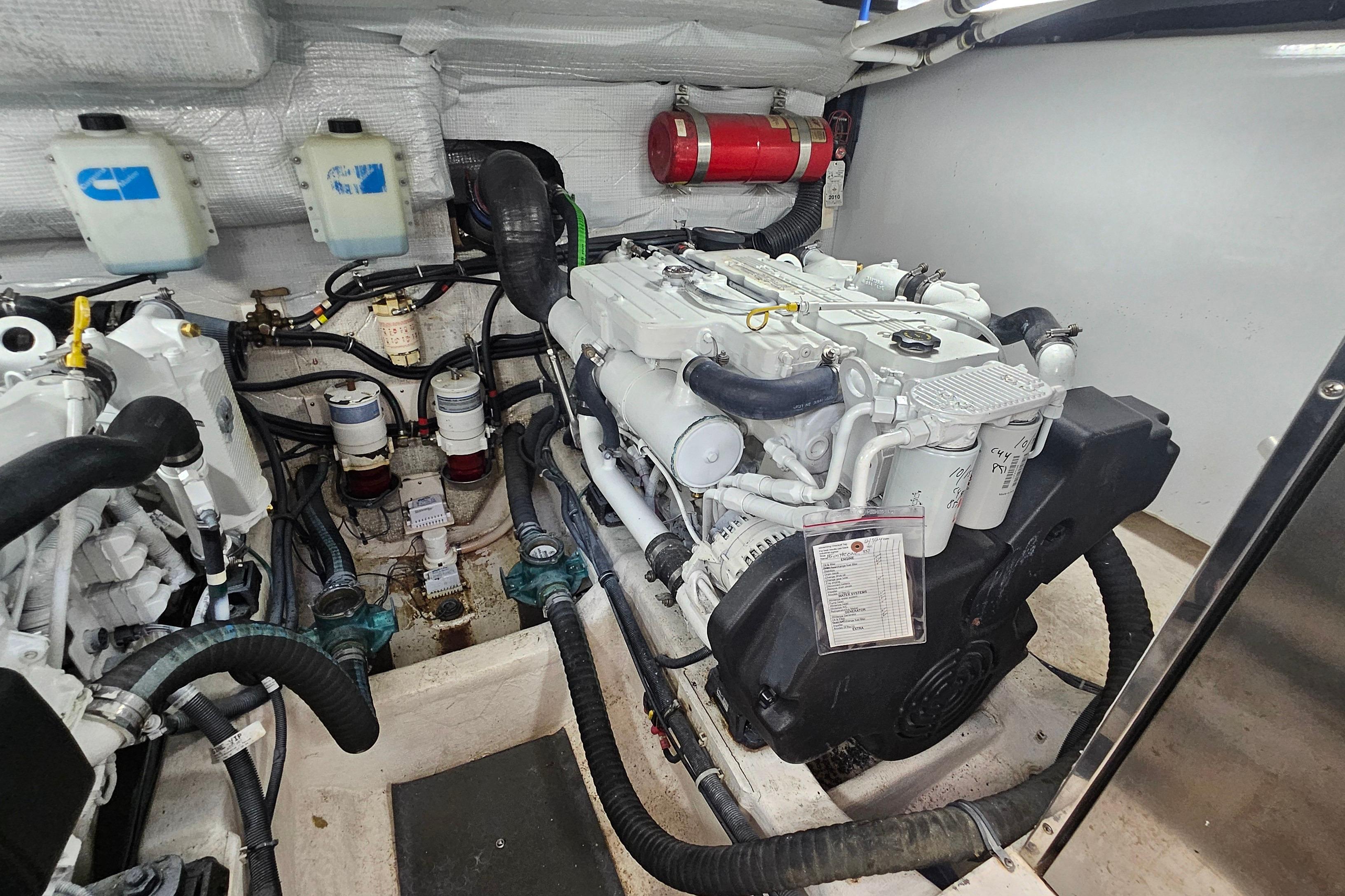 Engine room of 2009 Sabre 42 Express yacht, showcasing detailed mechanical components.