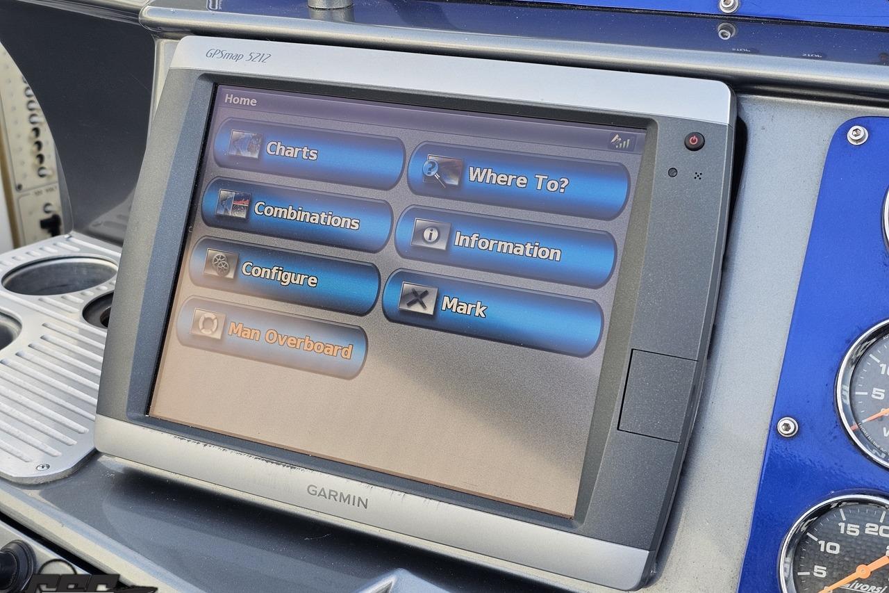Garmin GPSmap 5212 on 2007 Hustler 41 Razor boat dashboard, displaying navigation options.