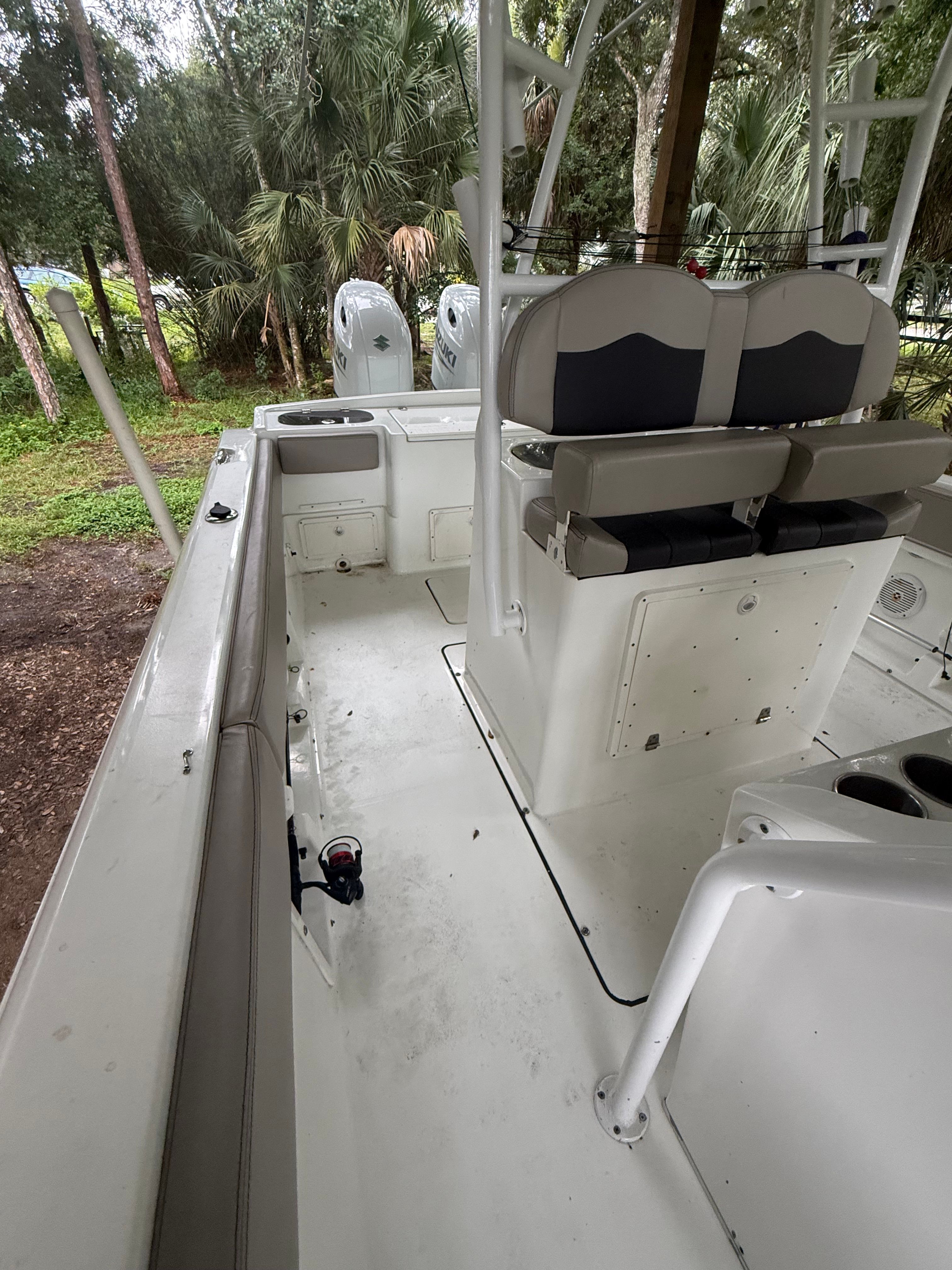The image shows the cockpit of a 2021 Clearwater 2508 Center Console boat.